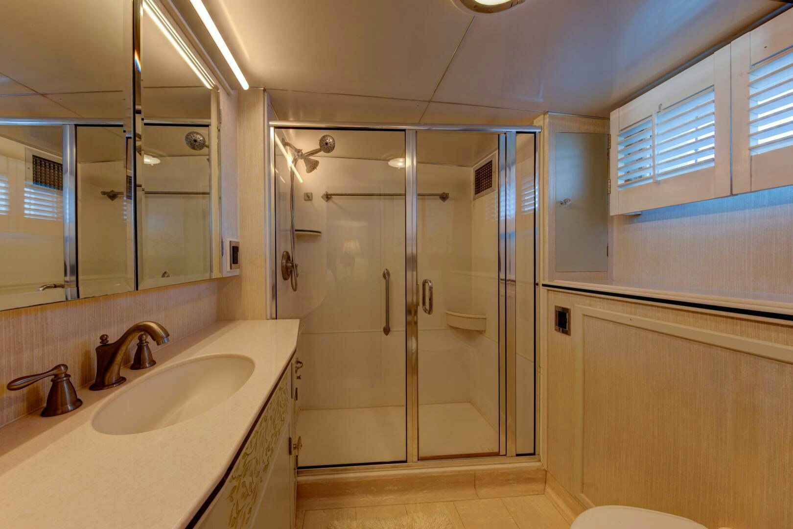 a bathroom with a shower and sink aboard KOALA Yacht for Sale