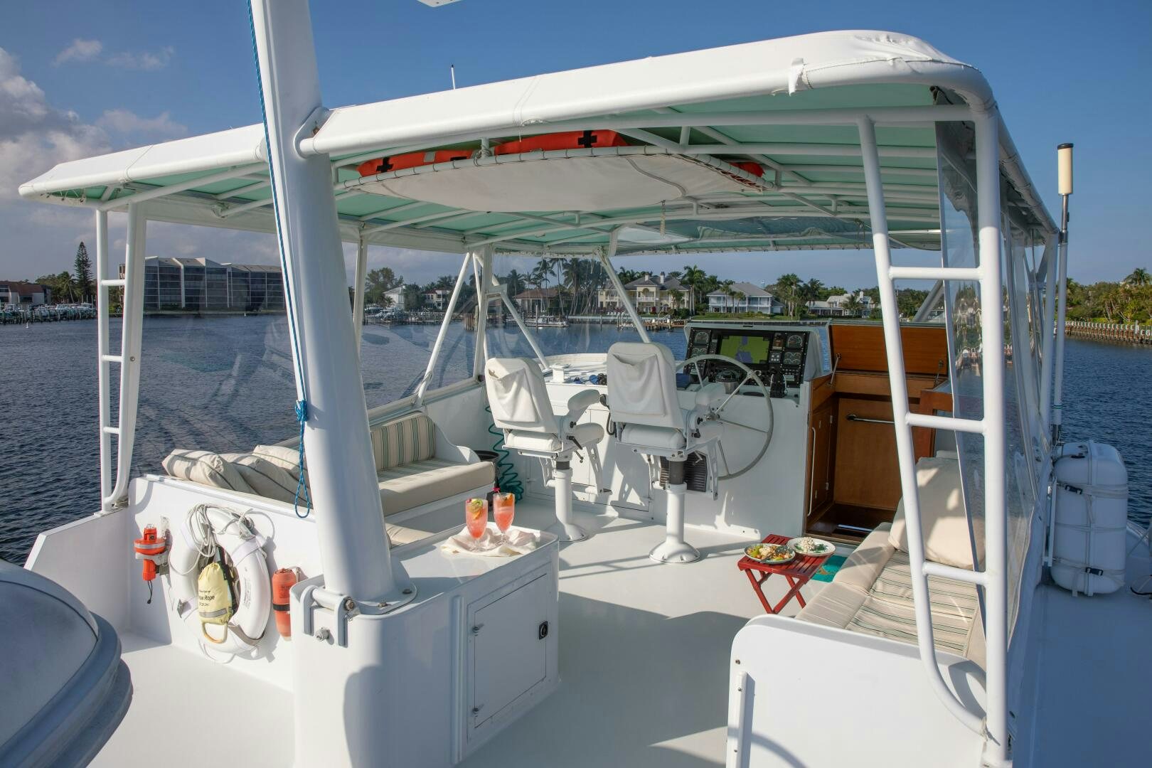 a boat with a canopy aboard KOALA Yacht for Sale