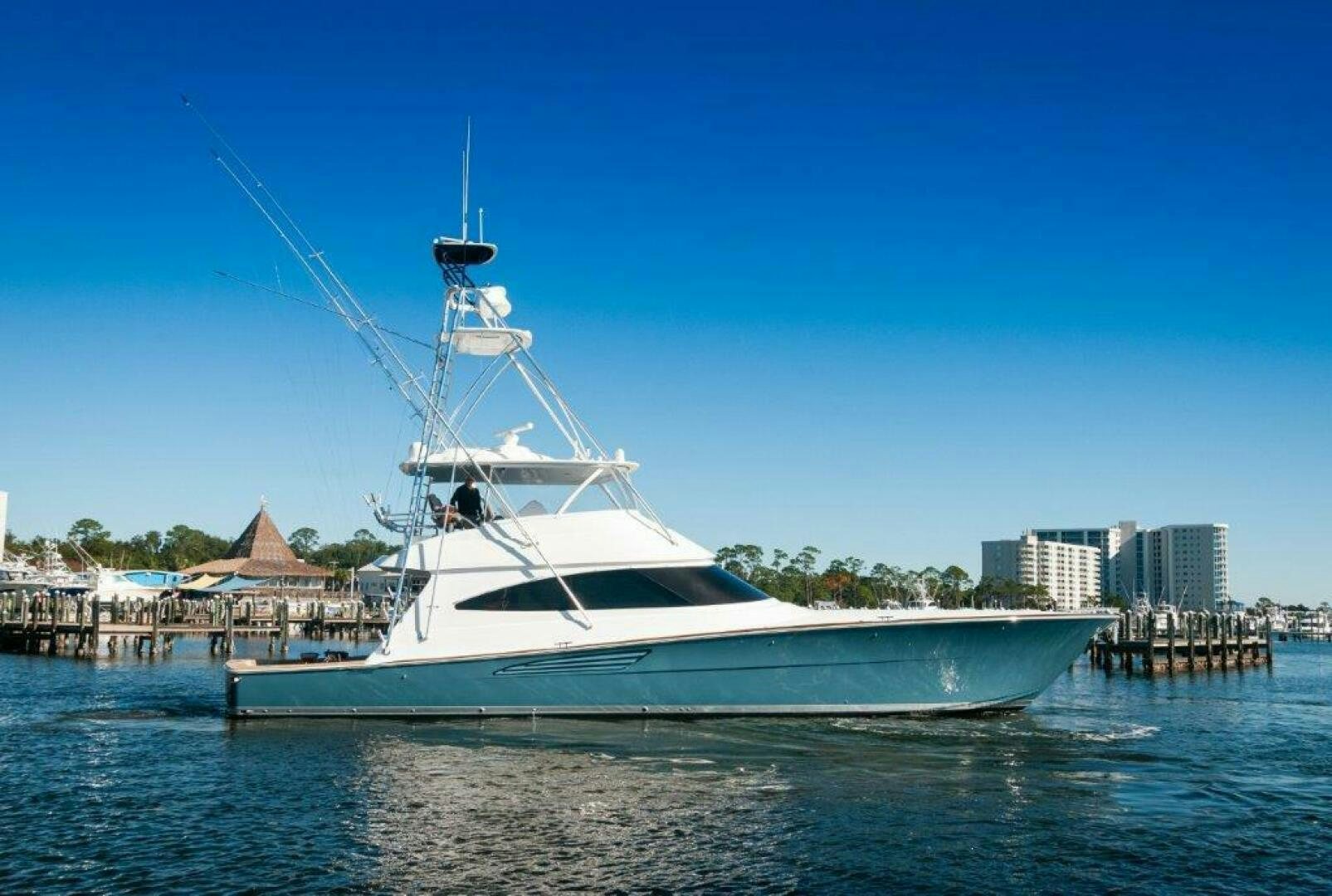 a white boat in the water aboard FLEUR DE LIS Yacht for Sale