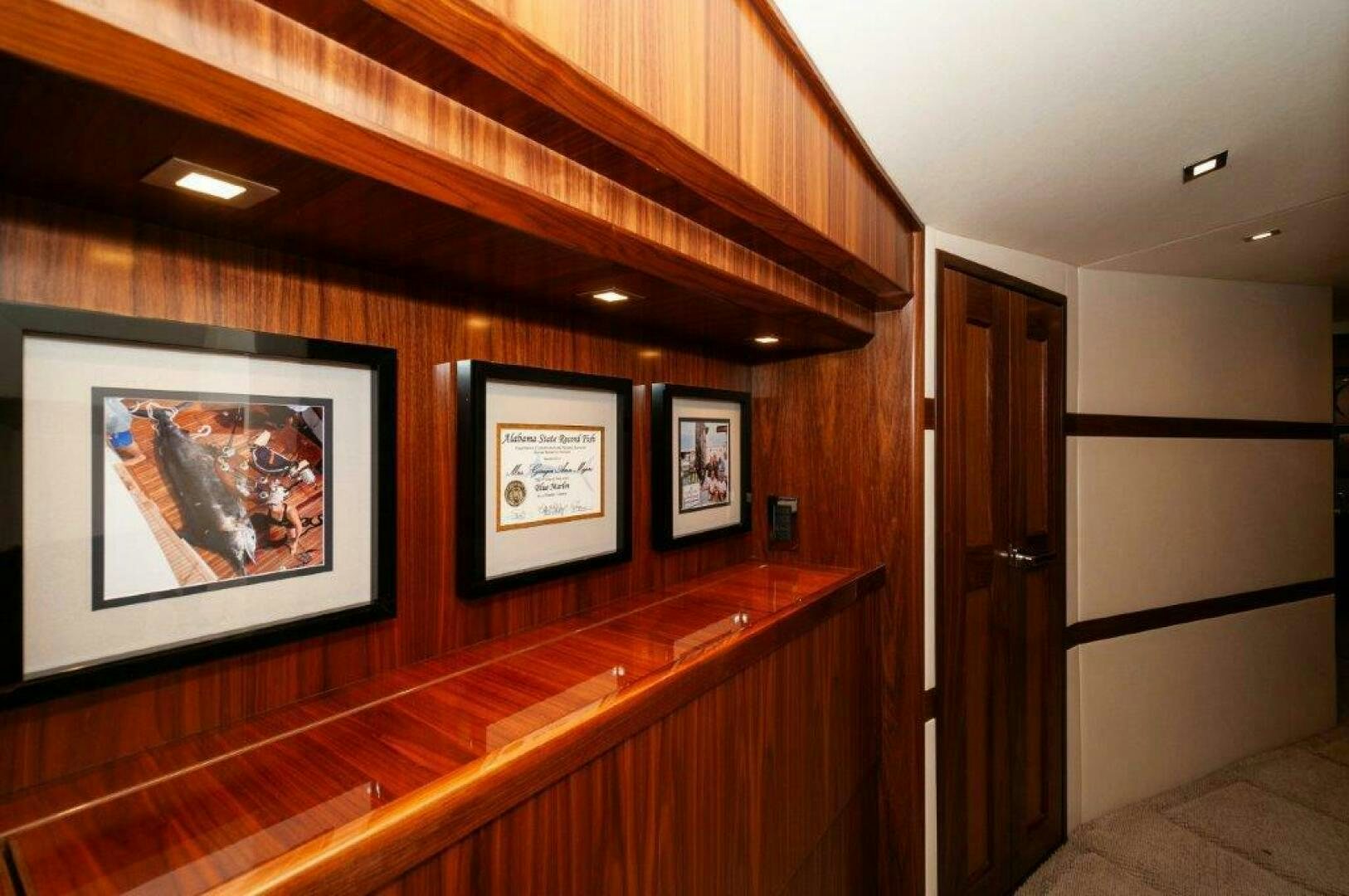 a room with paintings on the wall aboard FLEUR DE LIS Yacht for Sale