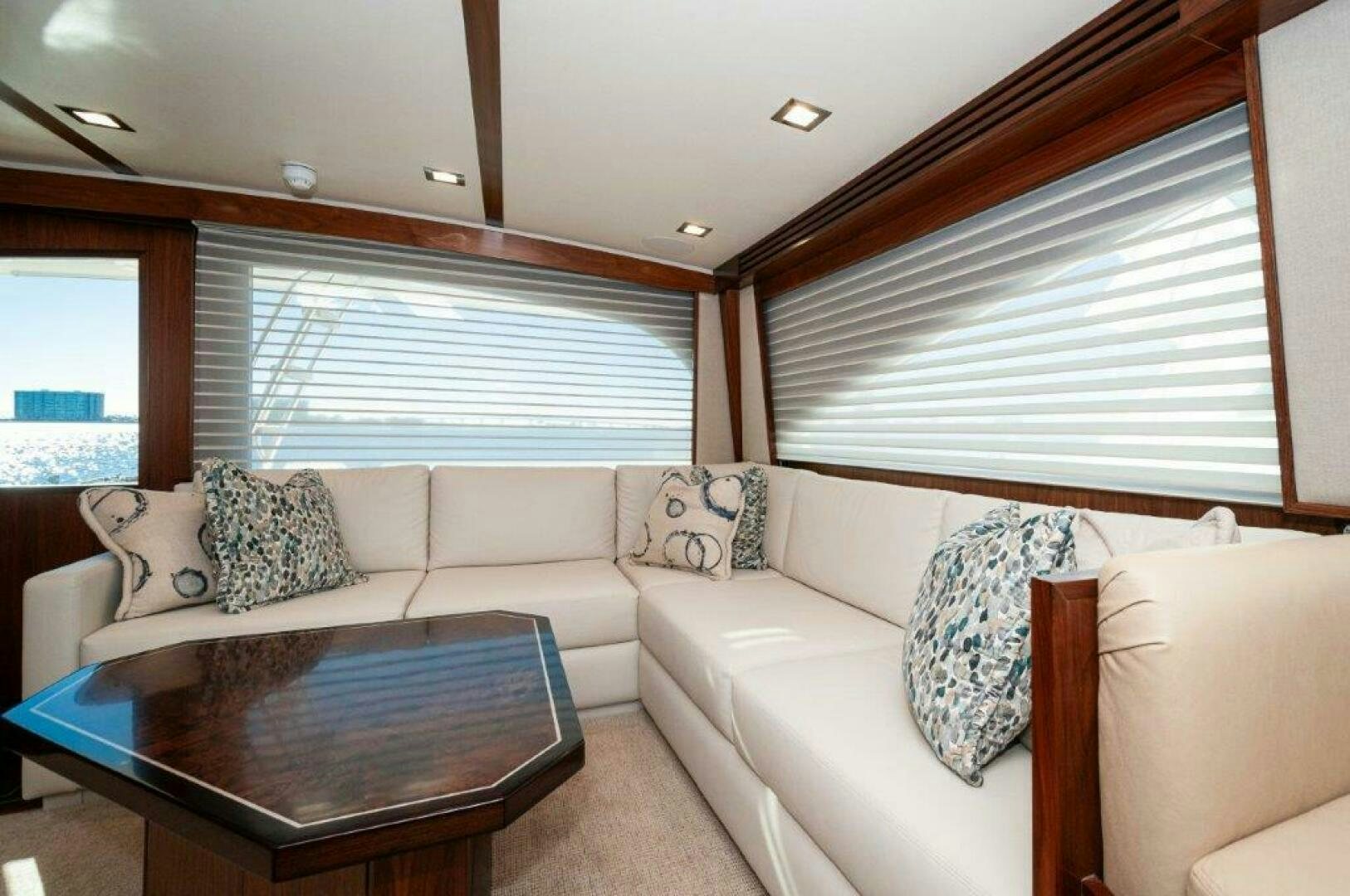 a living room with a couch and a coffee table aboard FLEUR DE LIS Yacht for Sale