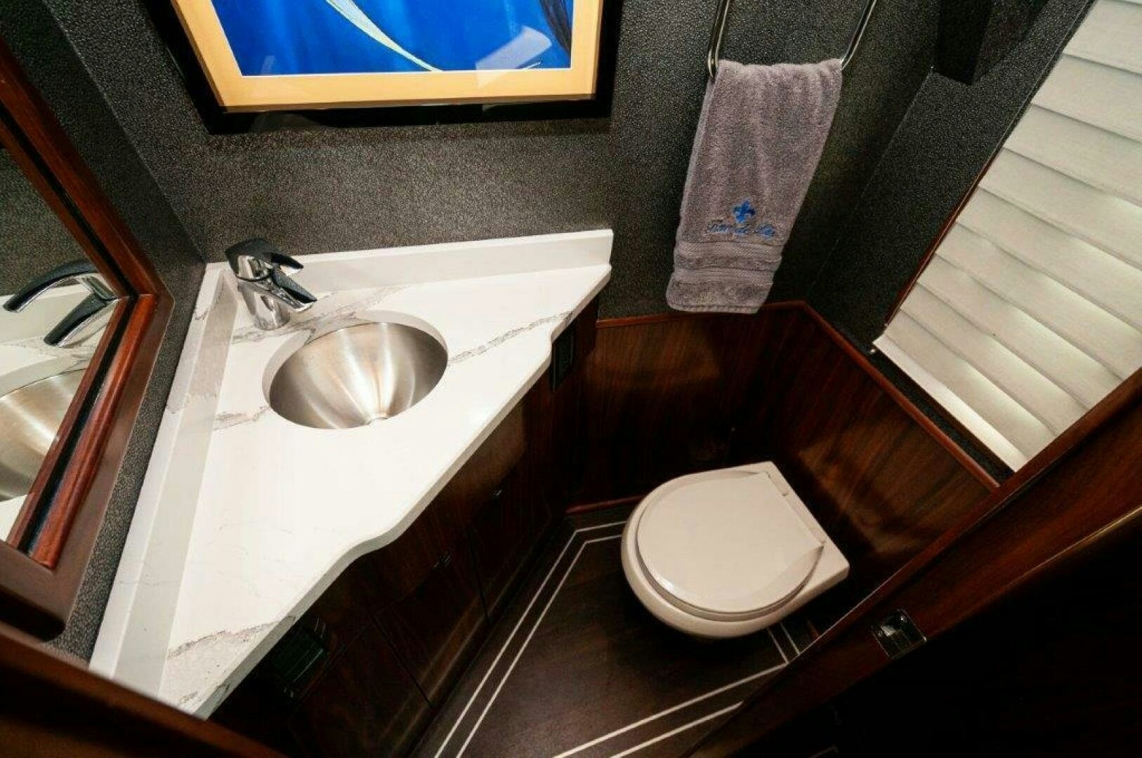 a bathroom with a sink and toilet aboard FLEUR DE LIS Yacht for Sale
