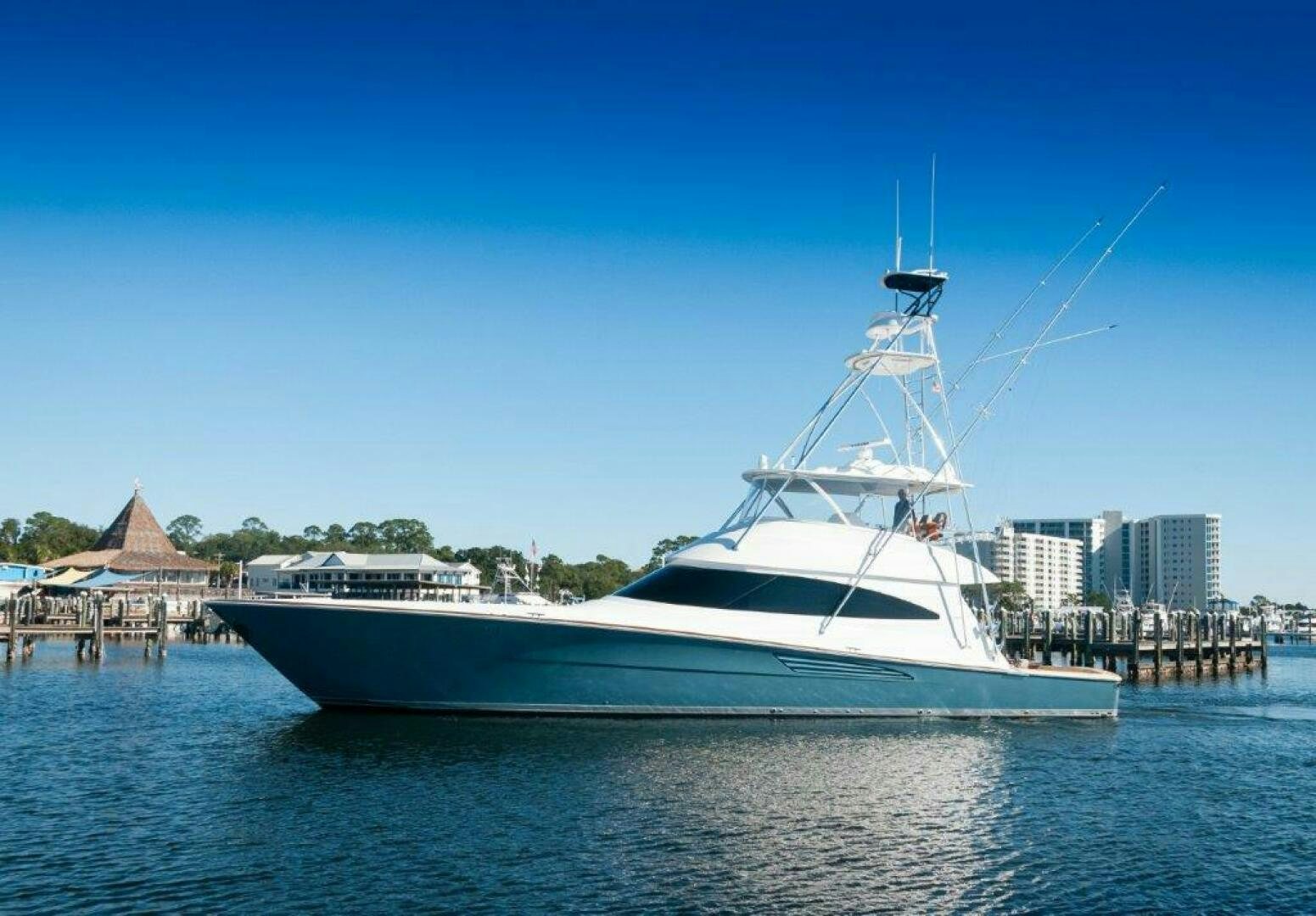 a large white boat on the water aboard FLEUR DE LIS Yacht for Sale