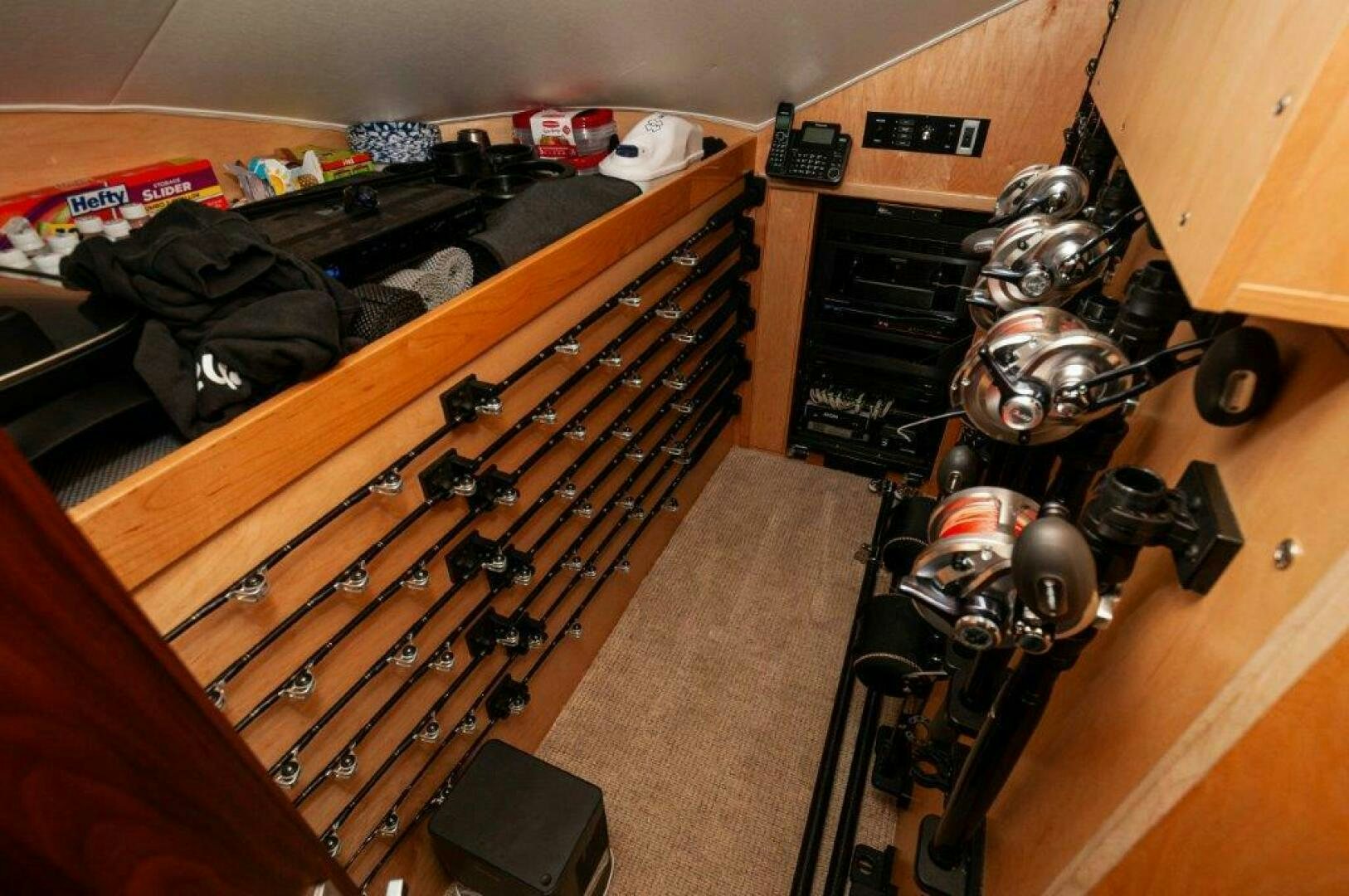 a guitar on a wooden floor aboard FLEUR DE LIS Yacht for Sale