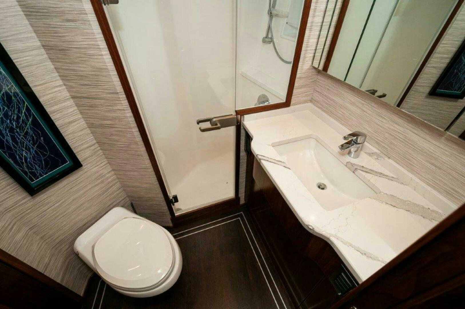 a bathroom with a sink and a toilet aboard FLEUR DE LIS Yacht for Sale