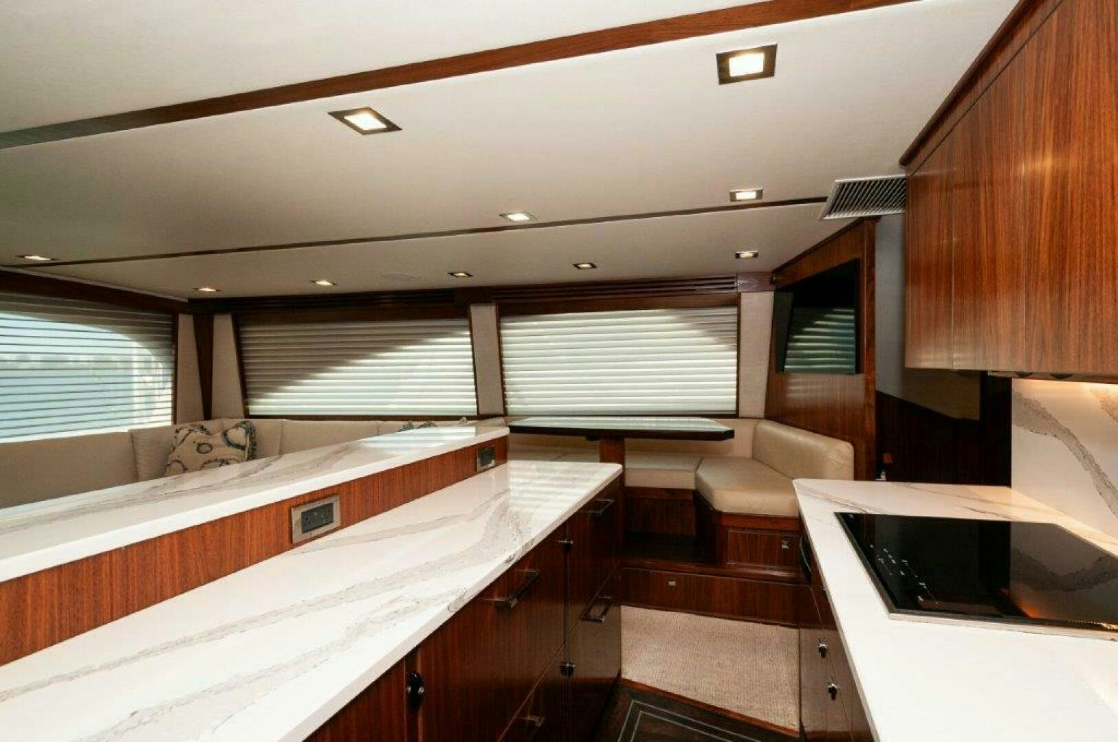 a room with a bed and a desk aboard FLEUR DE LIS Yacht for Sale