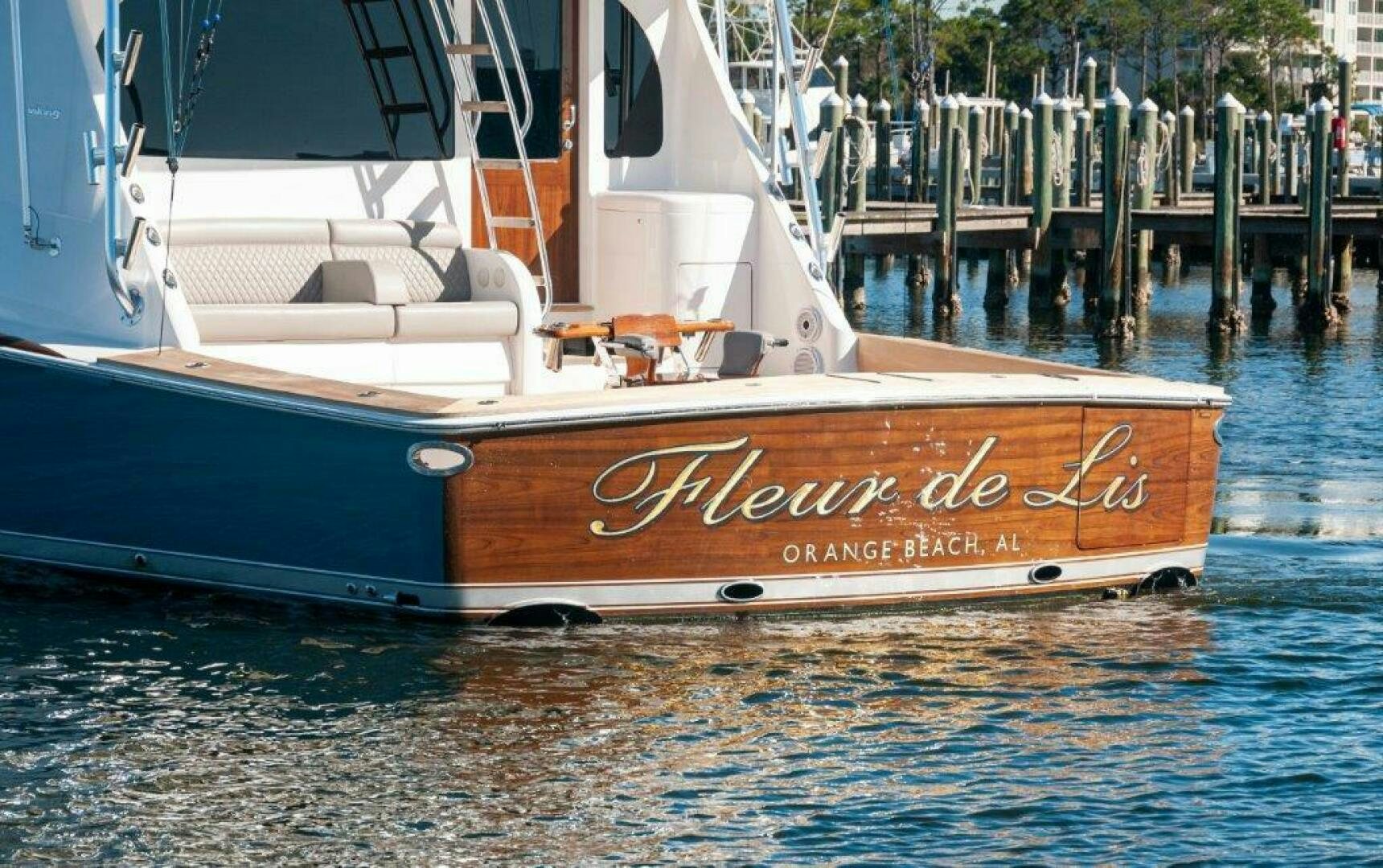a boat docked at a pier aboard FLEUR DE LIS Yacht for Sale