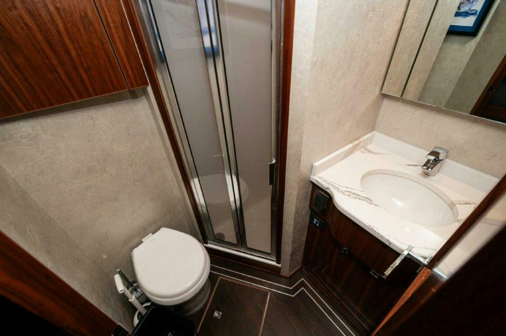 a bathroom with a standup shower aboard FLEUR DE LIS Yacht for Sale