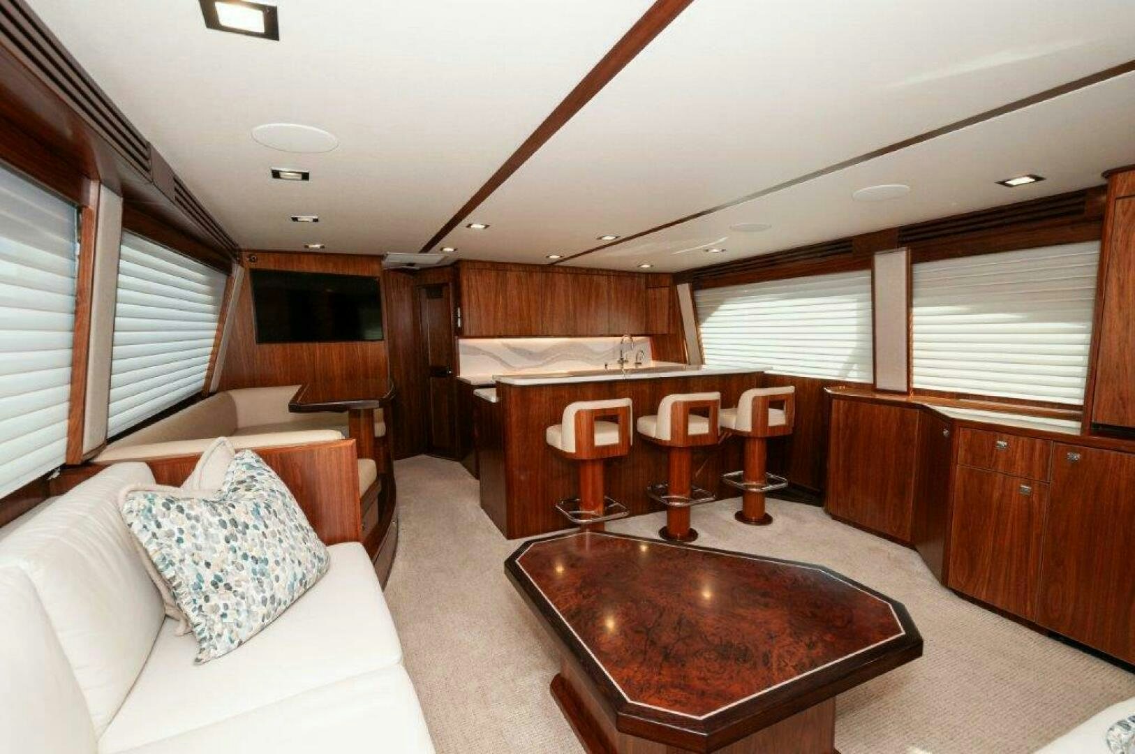 a room with a table and chairs aboard FLEUR DE LIS Yacht for Sale