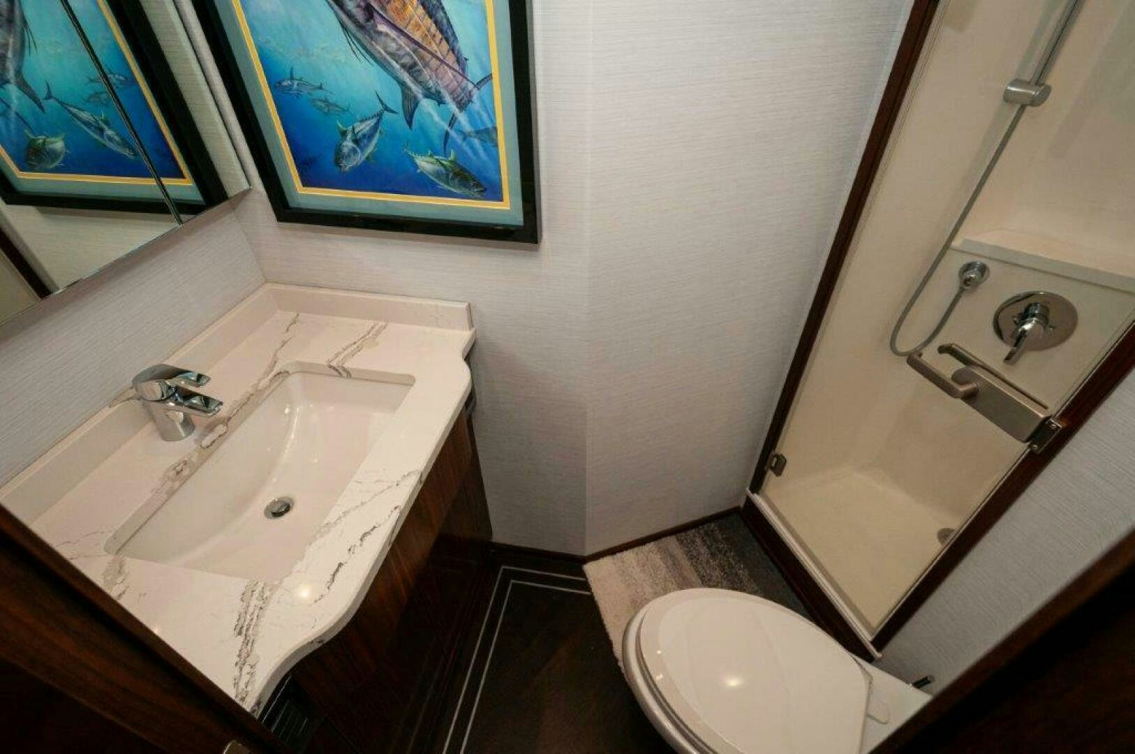 a bathroom with a sink and a toilet aboard FLEUR DE LIS Yacht for Sale