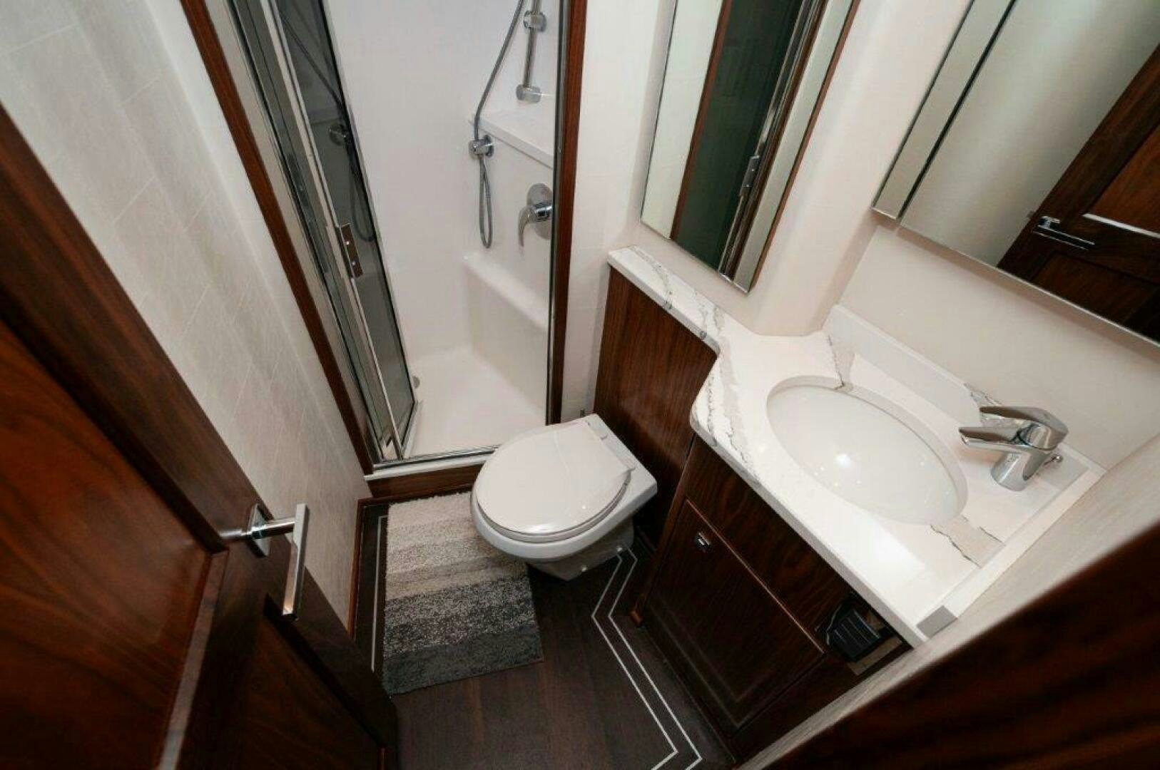 a bathroom with a sink and a toilet aboard FLEUR DE LIS Yacht for Sale