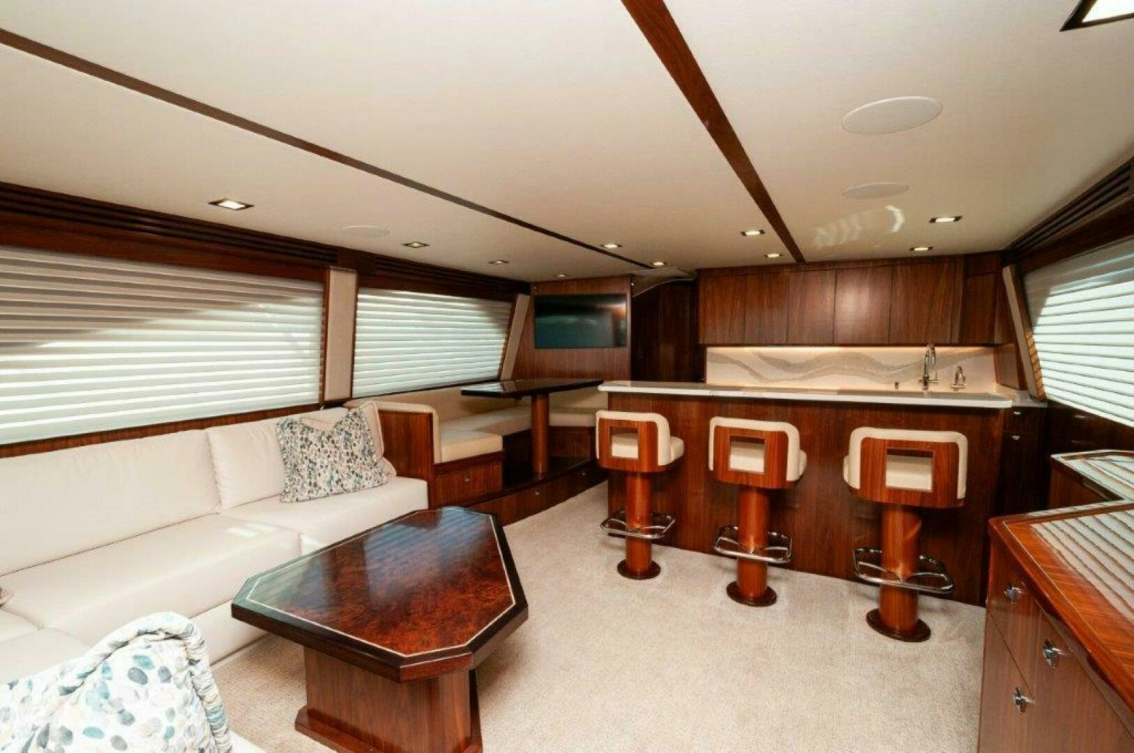 a living room with a couch and a table aboard FLEUR DE LIS Yacht for Sale