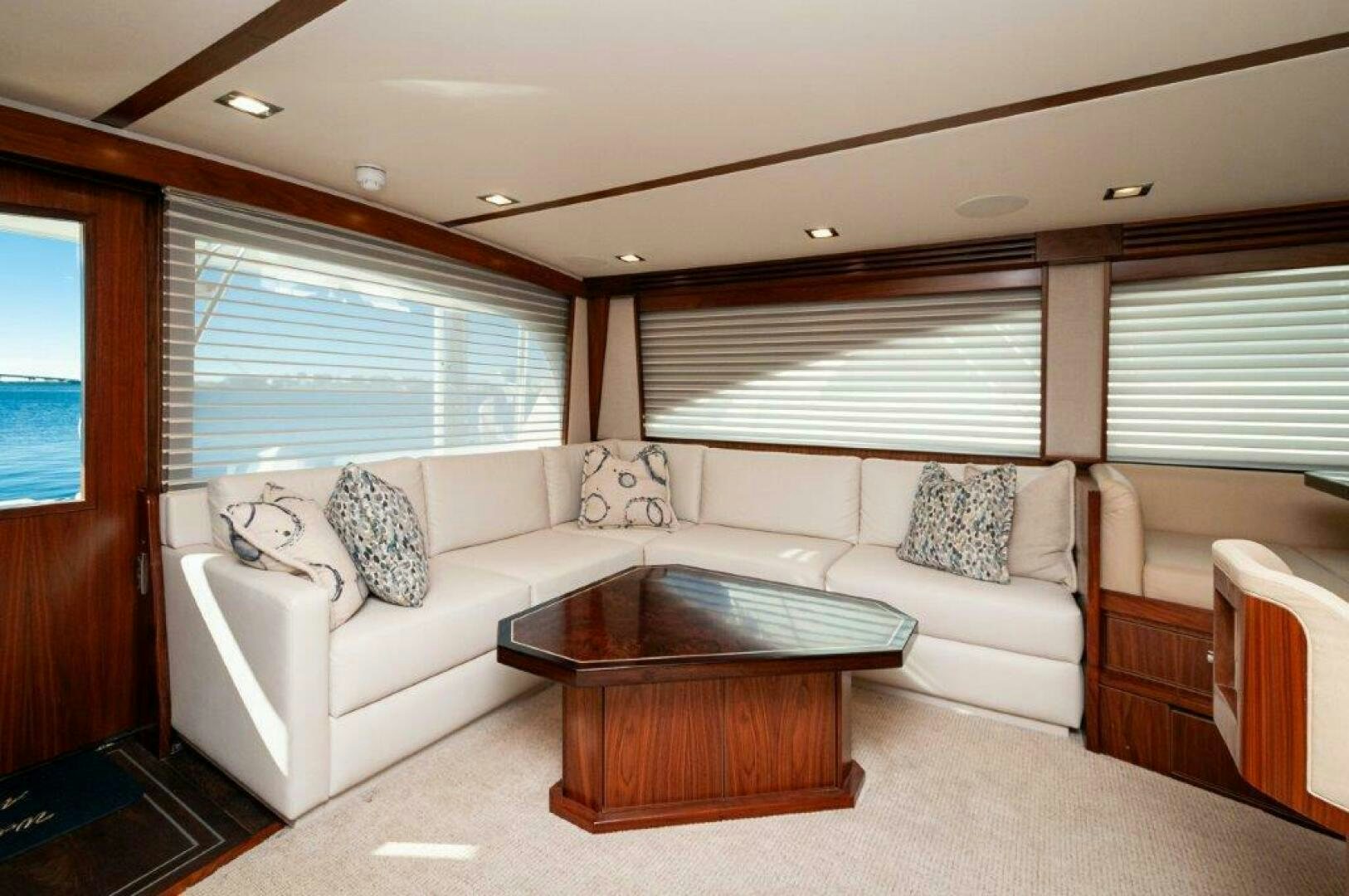 a living room with a couch and a coffee table aboard FLEUR DE LIS Yacht for Sale