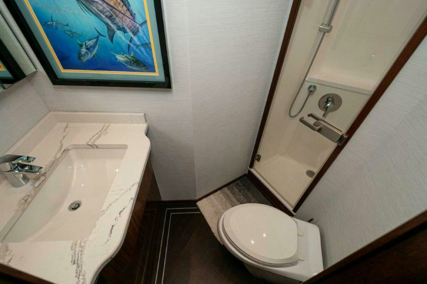 a bathroom with a sink and a toilet aboard FLEUR DE LIS Yacht for Sale
