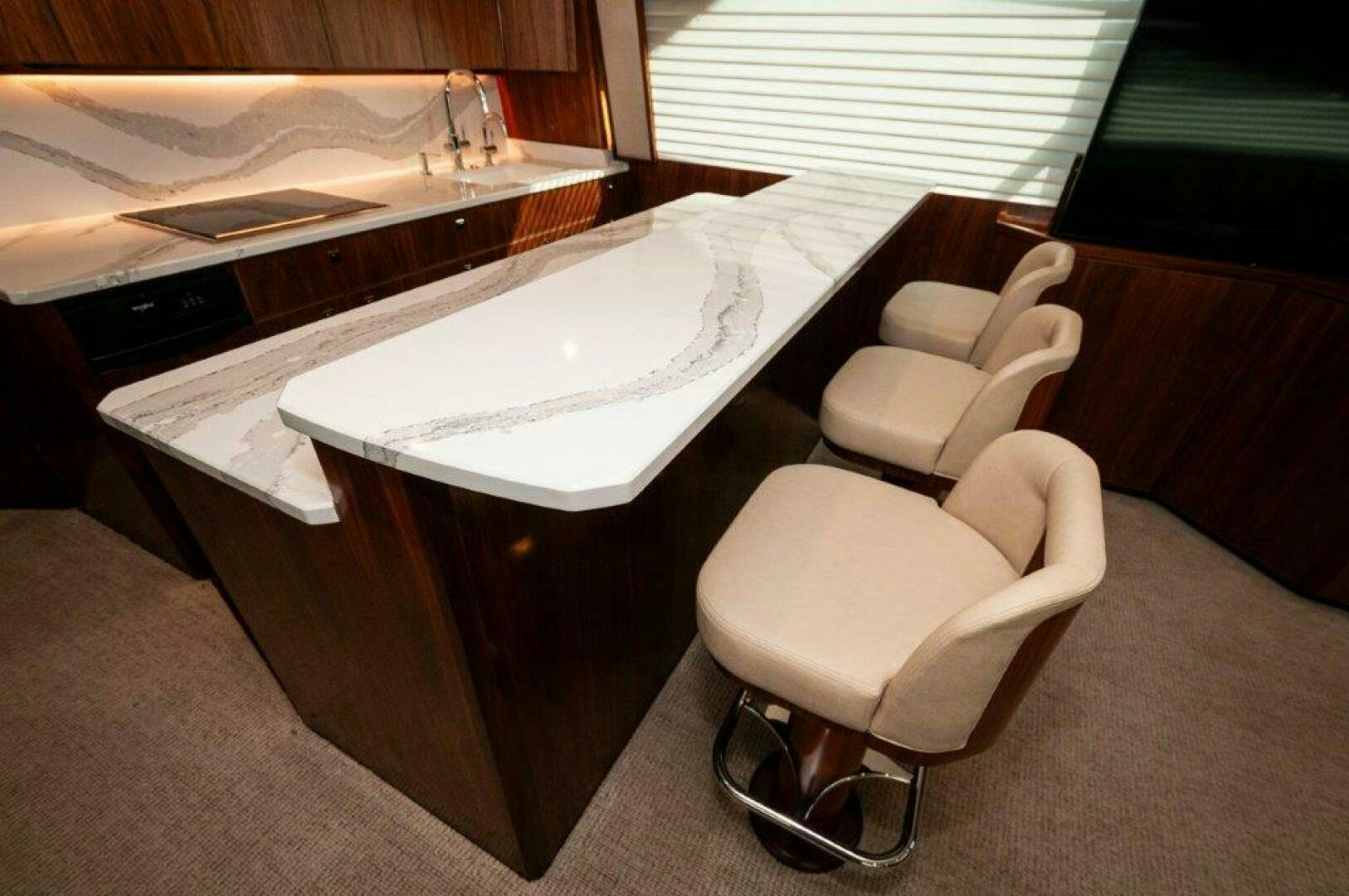 a chair next to a table aboard FLEUR DE LIS Yacht for Sale