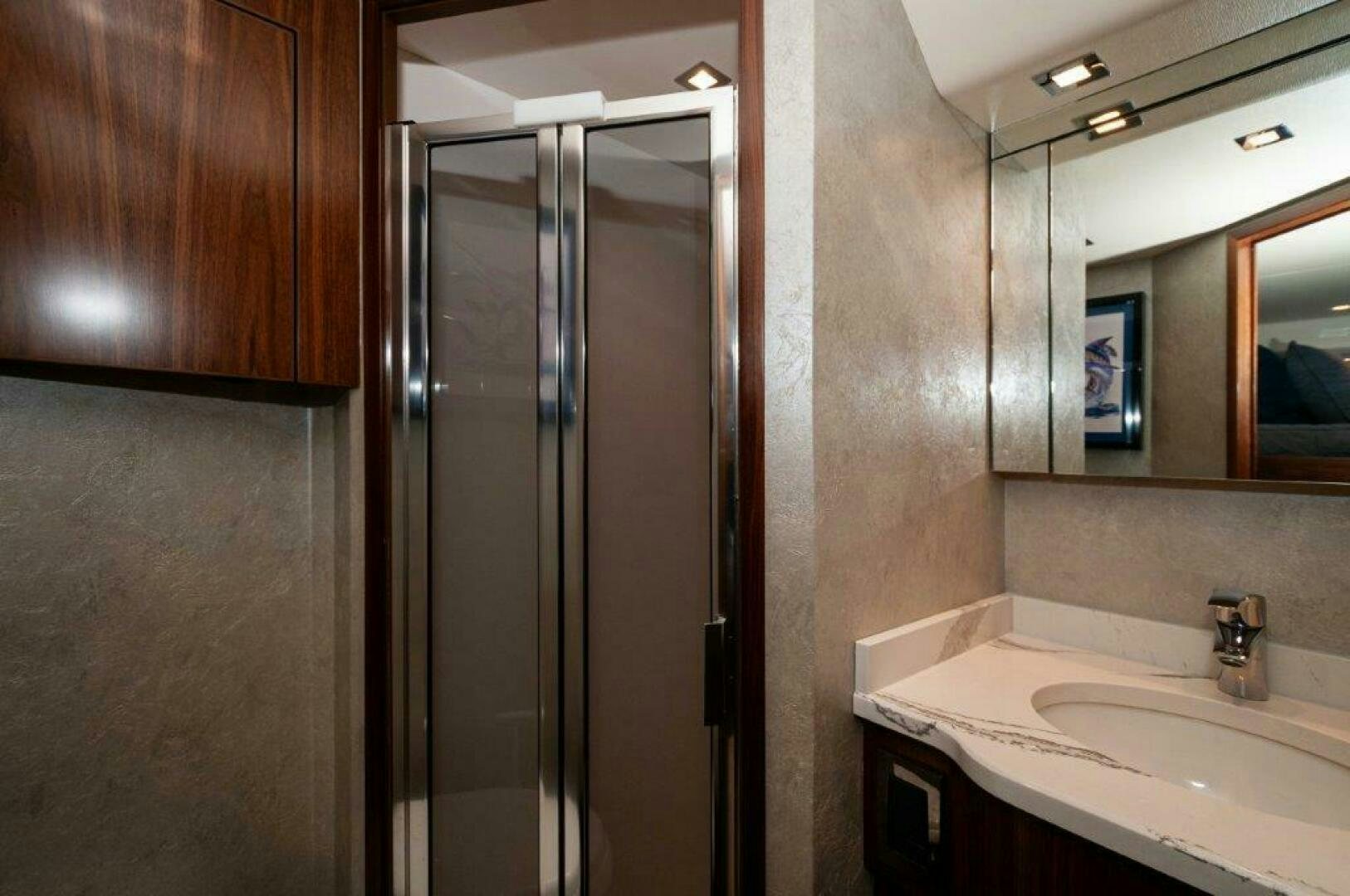 a bathroom with a glass shower aboard FLEUR DE LIS Yacht for Sale