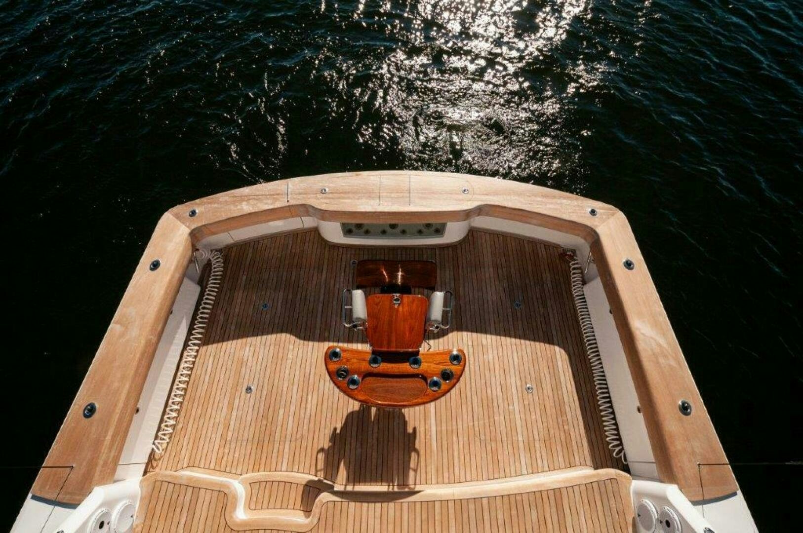 a wooden boat on the water aboard FLEUR DE LIS Yacht for Sale