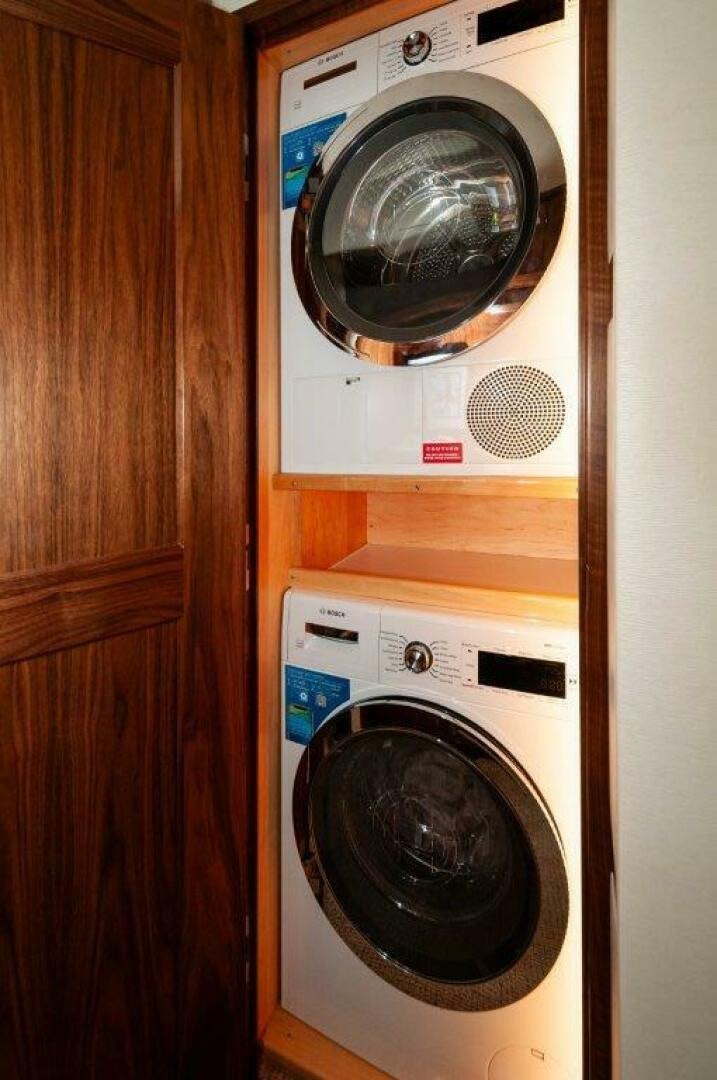 a white washing machine aboard FLEUR DE LIS Yacht for Sale