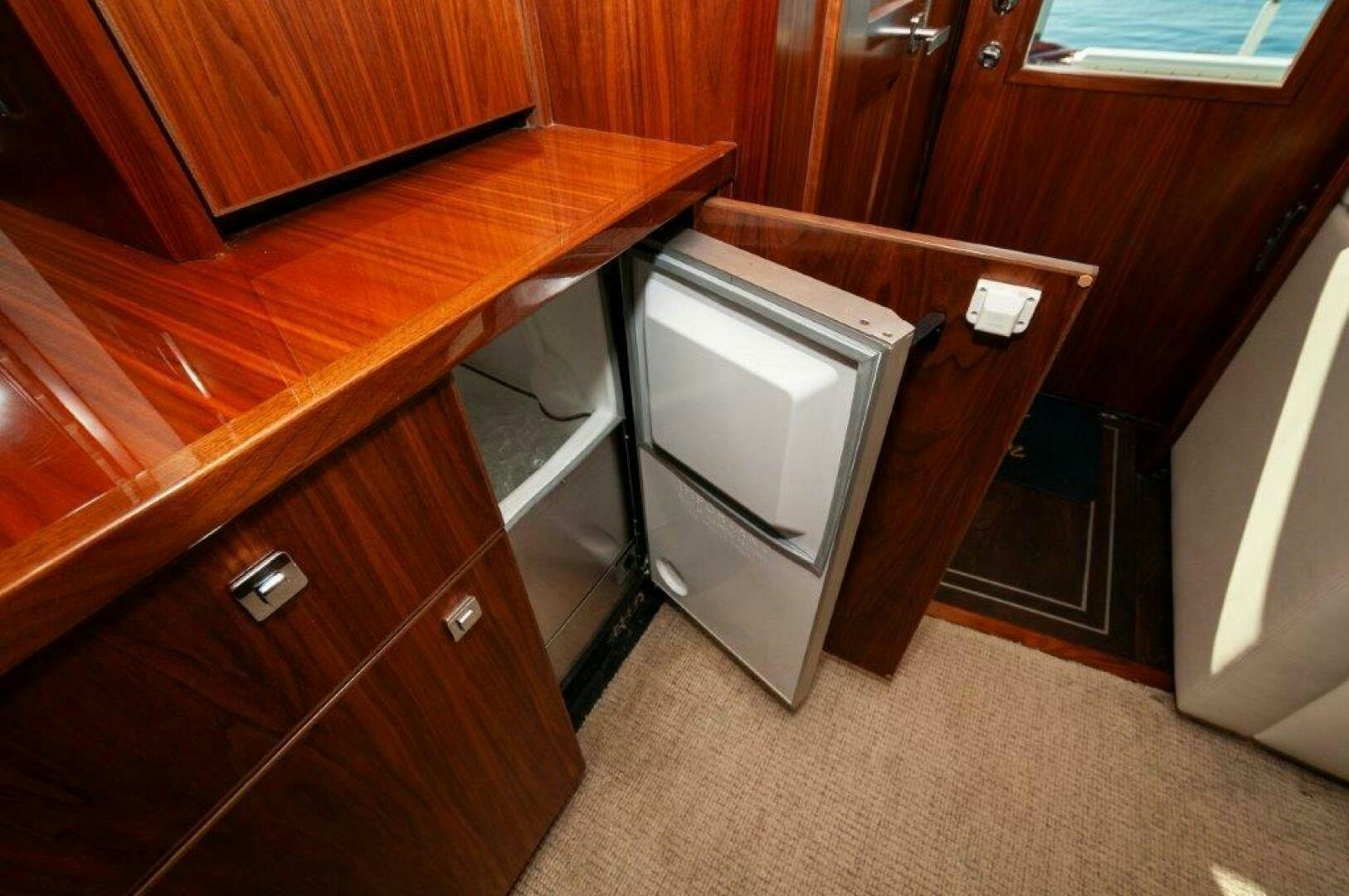 a microwave oven on a wooden table aboard FLEUR DE LIS Yacht for Sale