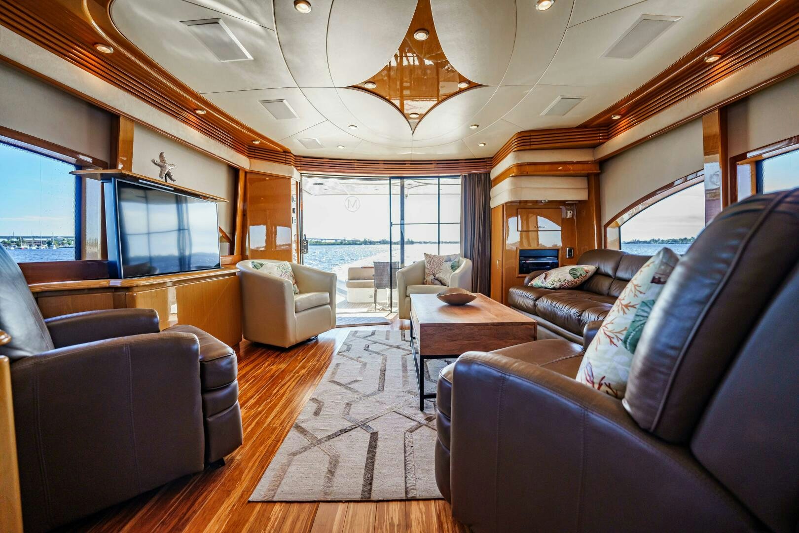 a living room with a large window aboard SERENITY Yacht for Sale