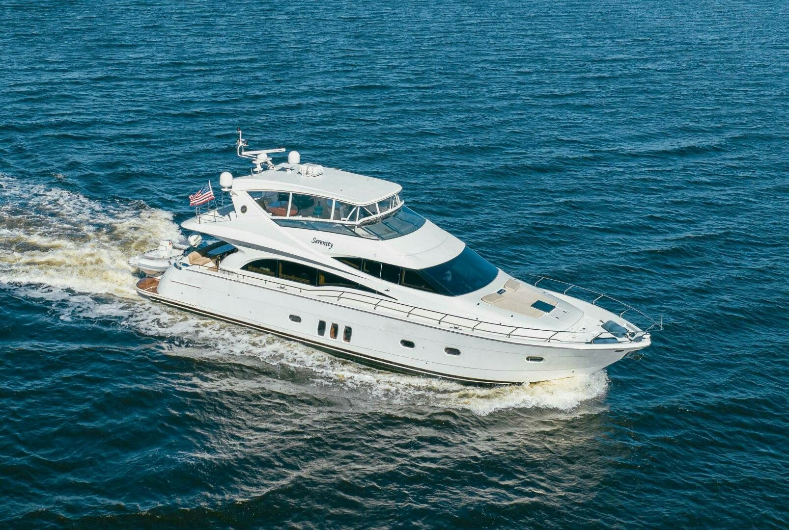 a white yacht on the water aboard SERENITY Yacht for Sale