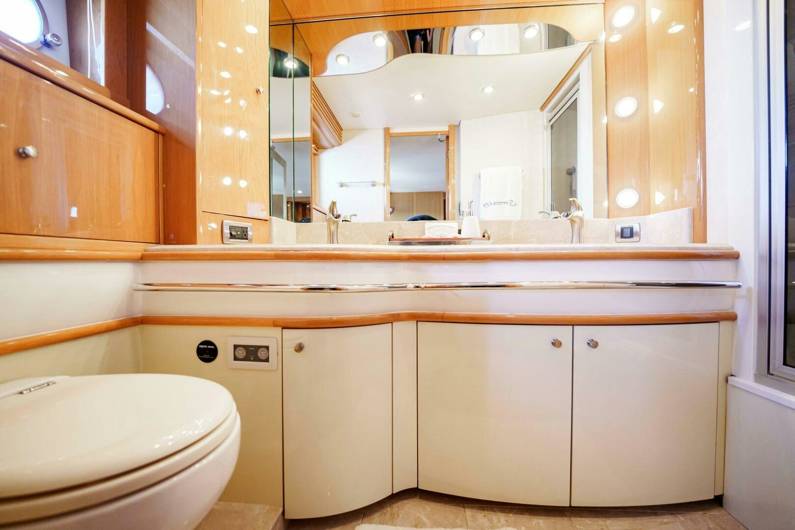 a bathroom with a toilet and a sink aboard SERENITY Yacht for Sale