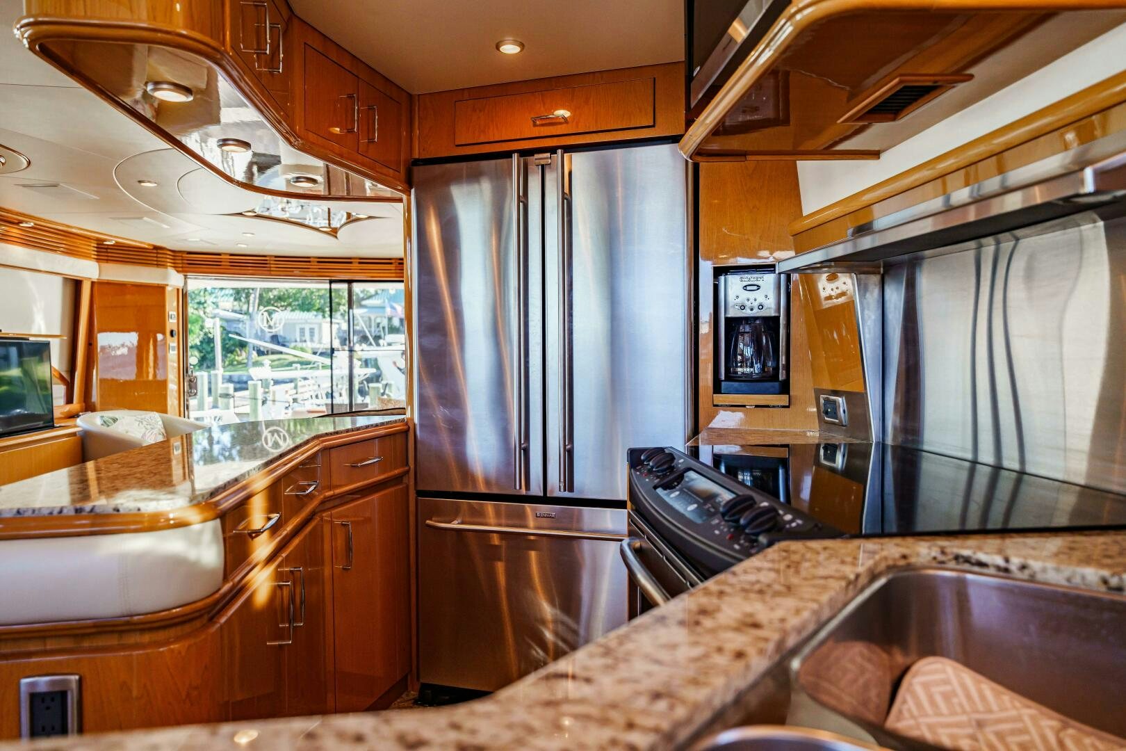 a kitchen with a large marble counter top aboard SERENITY Yacht for Sale