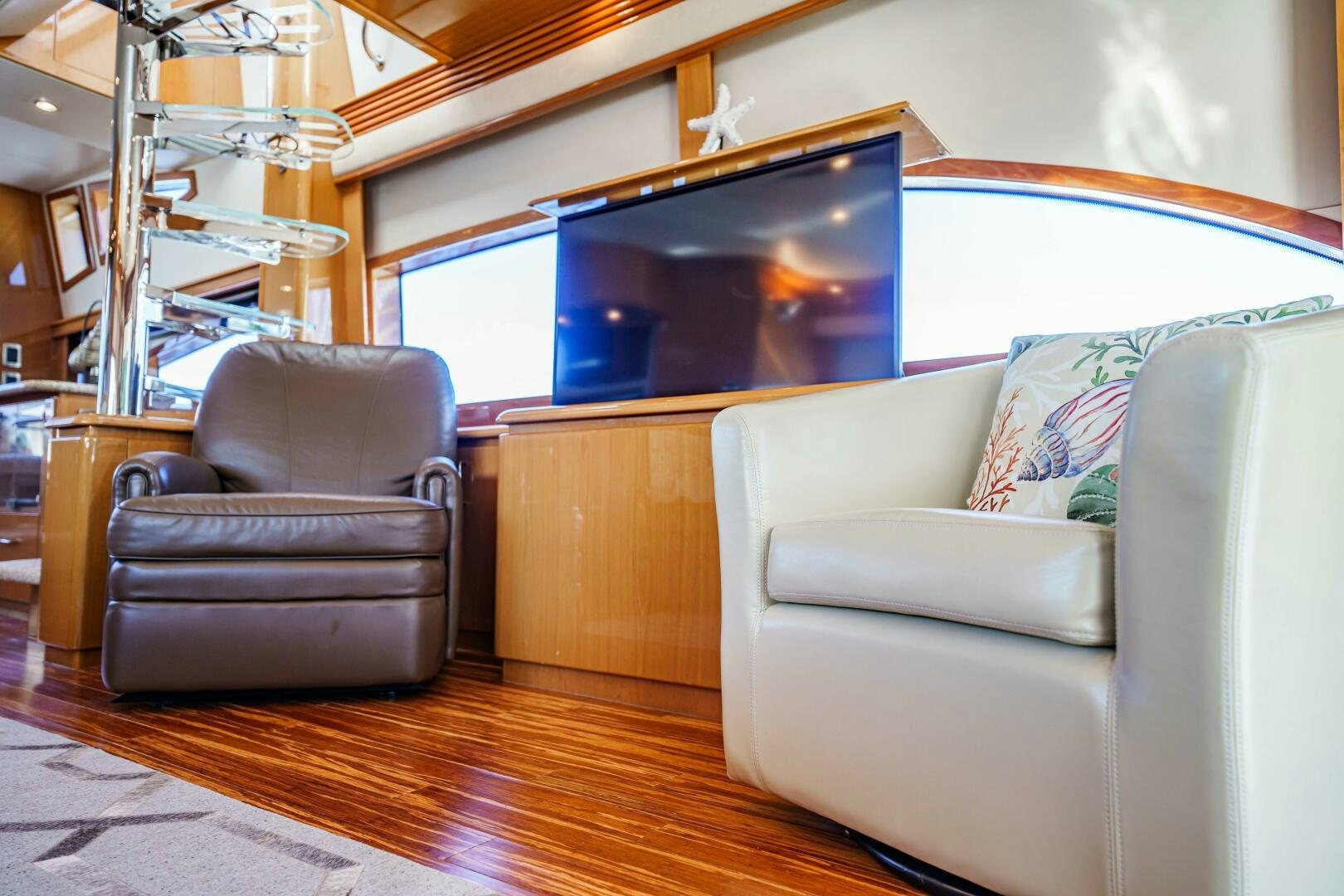a living room with a couch and a tv aboard SERENITY Yacht for Sale