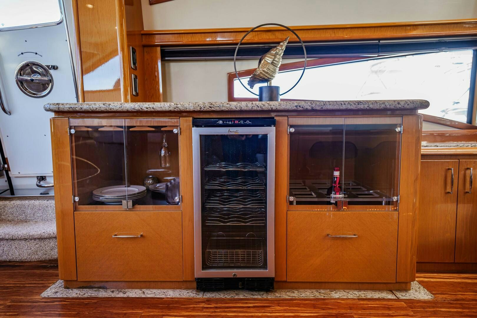 a kitchen with wooden cabinets aboard SERENITY Yacht for Sale