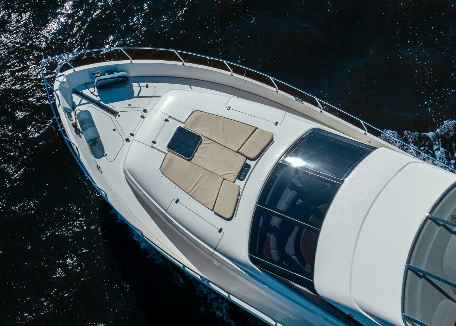 a white car parked in a snowy parking lot aboard SERENITY Yacht for Sale