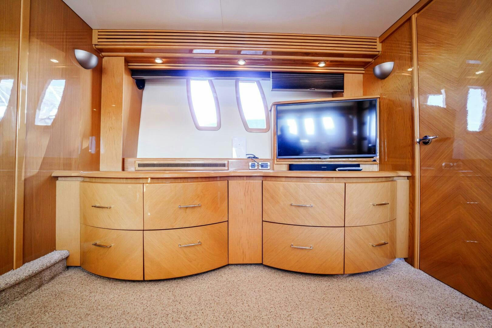a tv on a dresser aboard SERENITY Yacht for Sale