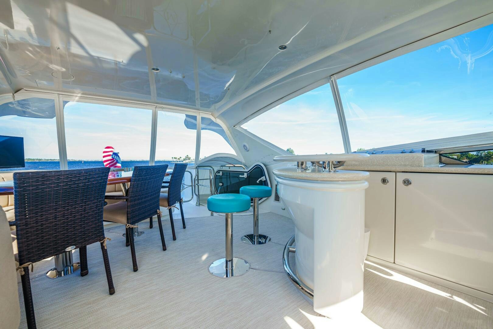 a room with chairs and tables aboard SERENITY Yacht for Sale