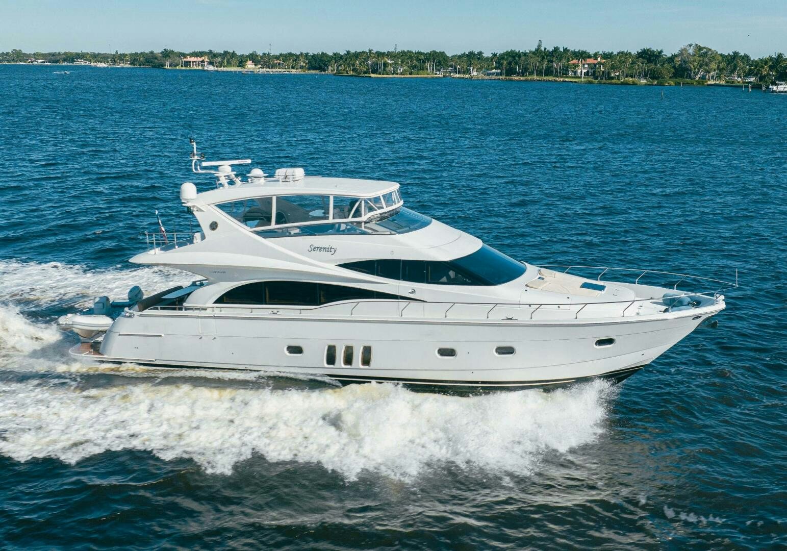 a white yacht on the water aboard SERENITY Yacht for Sale