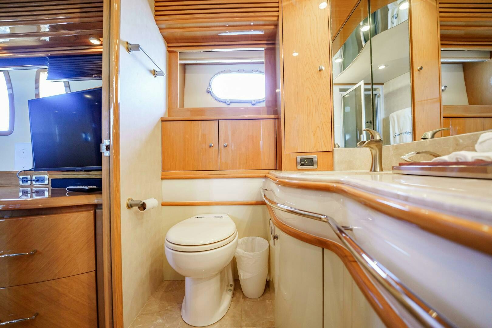a bathroom with a tub sink and toilet aboard SERENITY Yacht for Sale