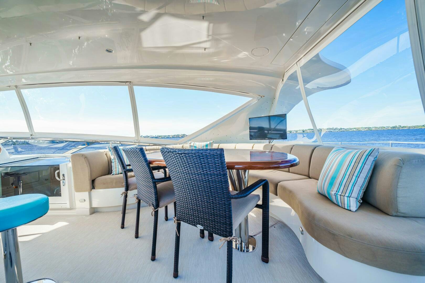 a room with a couch and a table and chairs aboard SERENITY Yacht for Sale