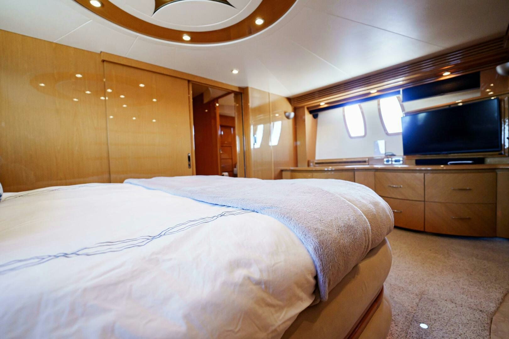 a room with a bed and a tv aboard SERENITY Yacht for Sale