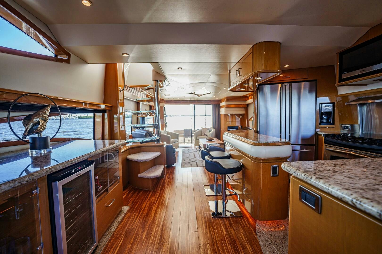 a kitchen with a wood floor aboard SERENITY Yacht for Sale
