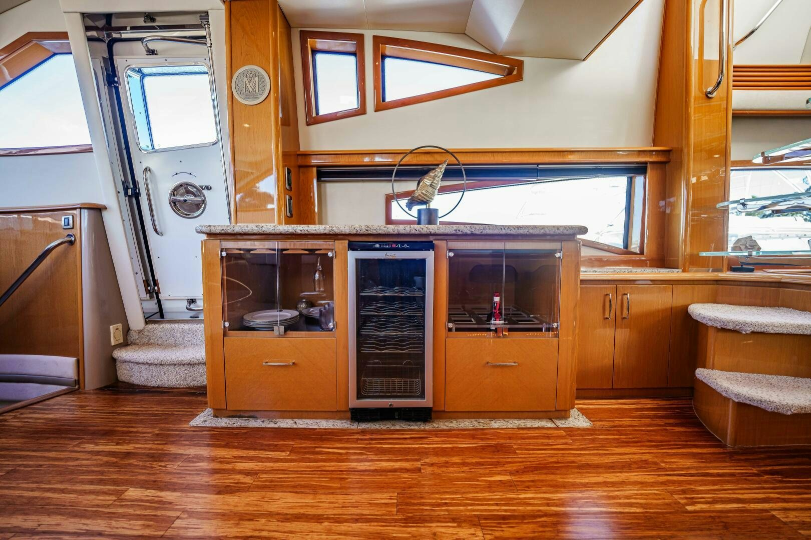 a room with a wood cabinet and a bed aboard SERENITY Yacht for Sale