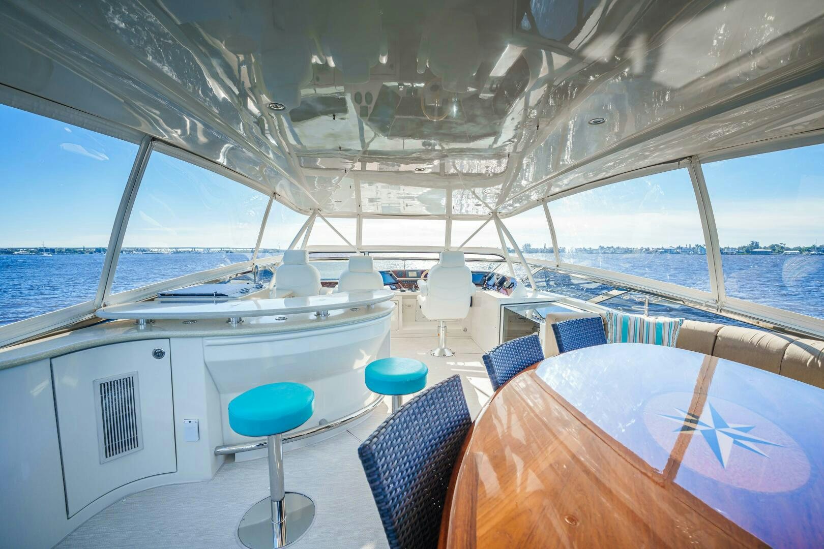 a boat with a table and chairs on the deck aboard SERENITY Yacht for Sale