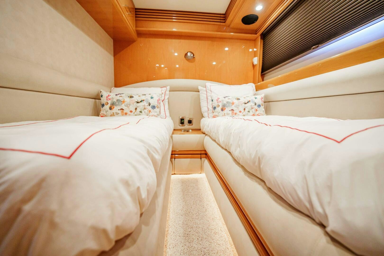 a room with beds and a wood ceiling aboard SERENITY Yacht for Sale