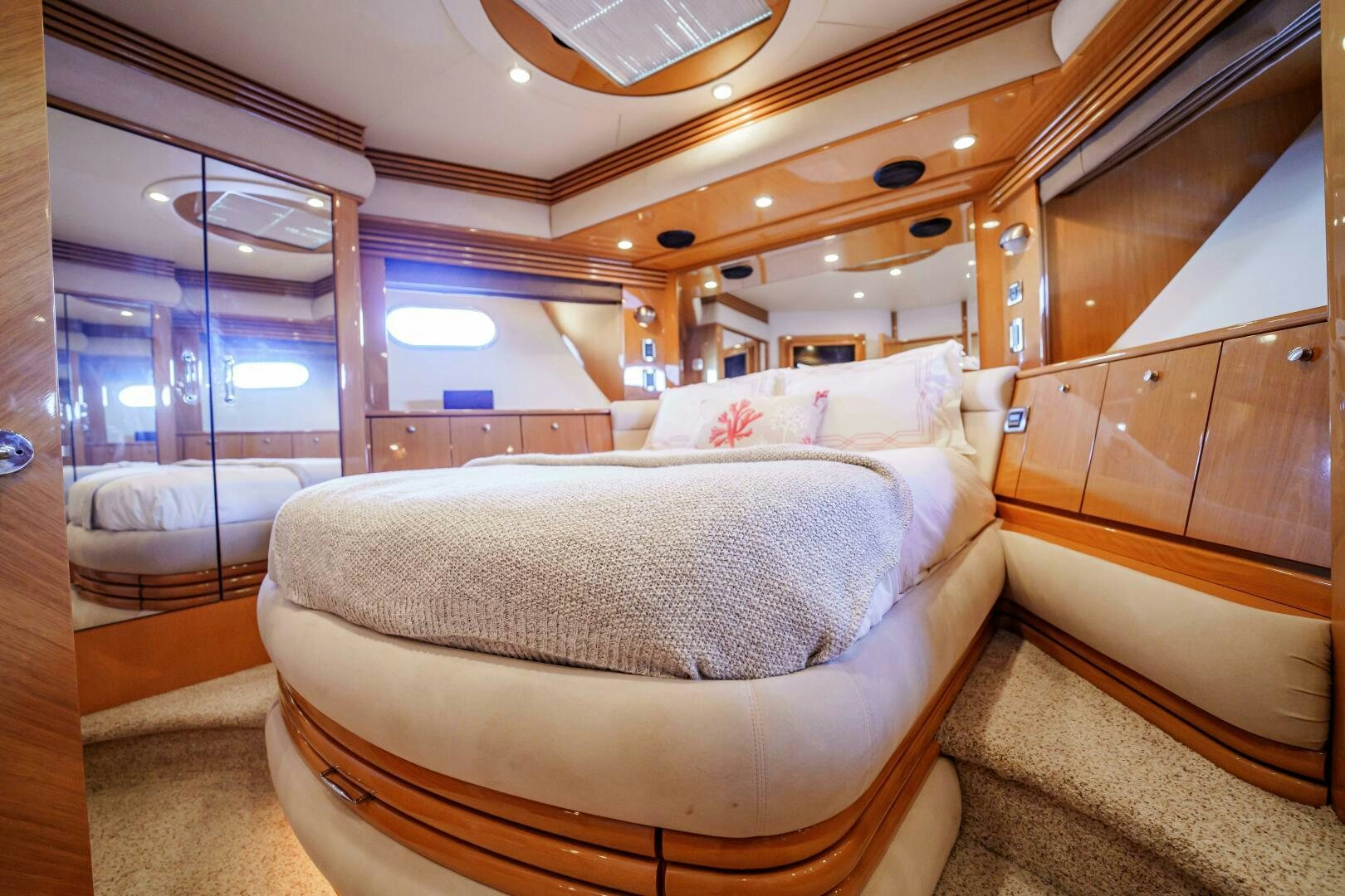 a room with a bed and a mirror aboard SERENITY Yacht for Sale