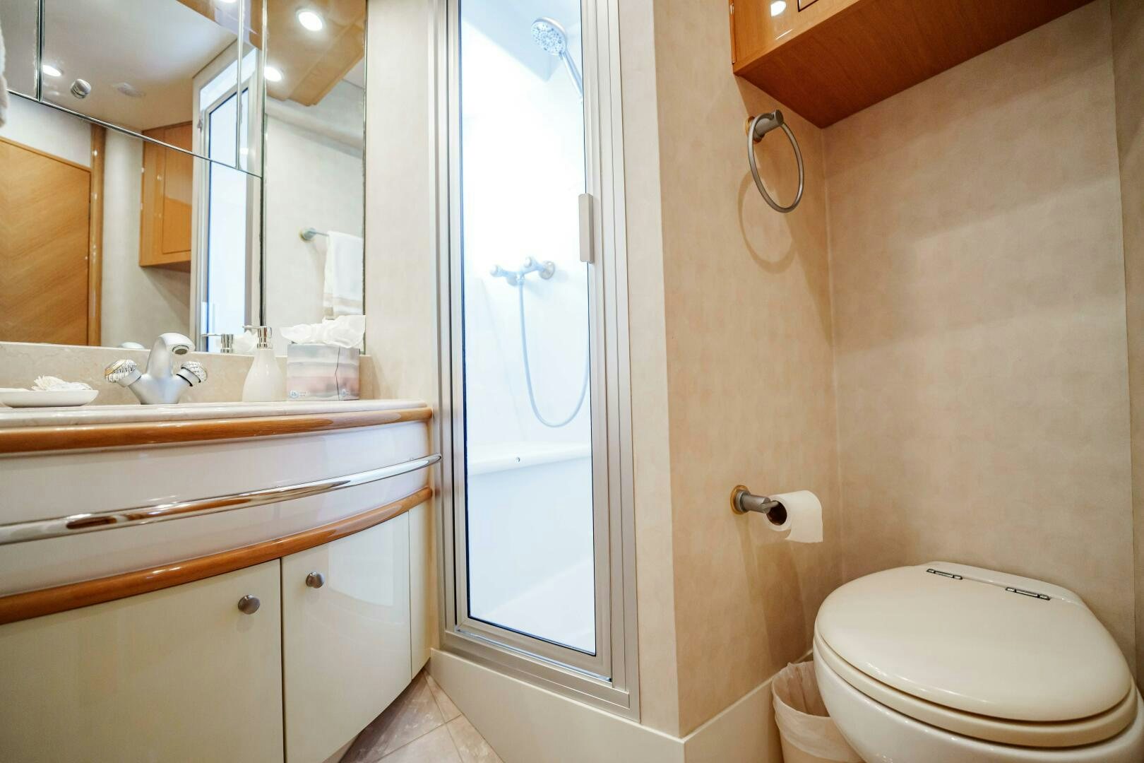 a bathroom with a toilet and a sink aboard SERENITY Yacht for Sale