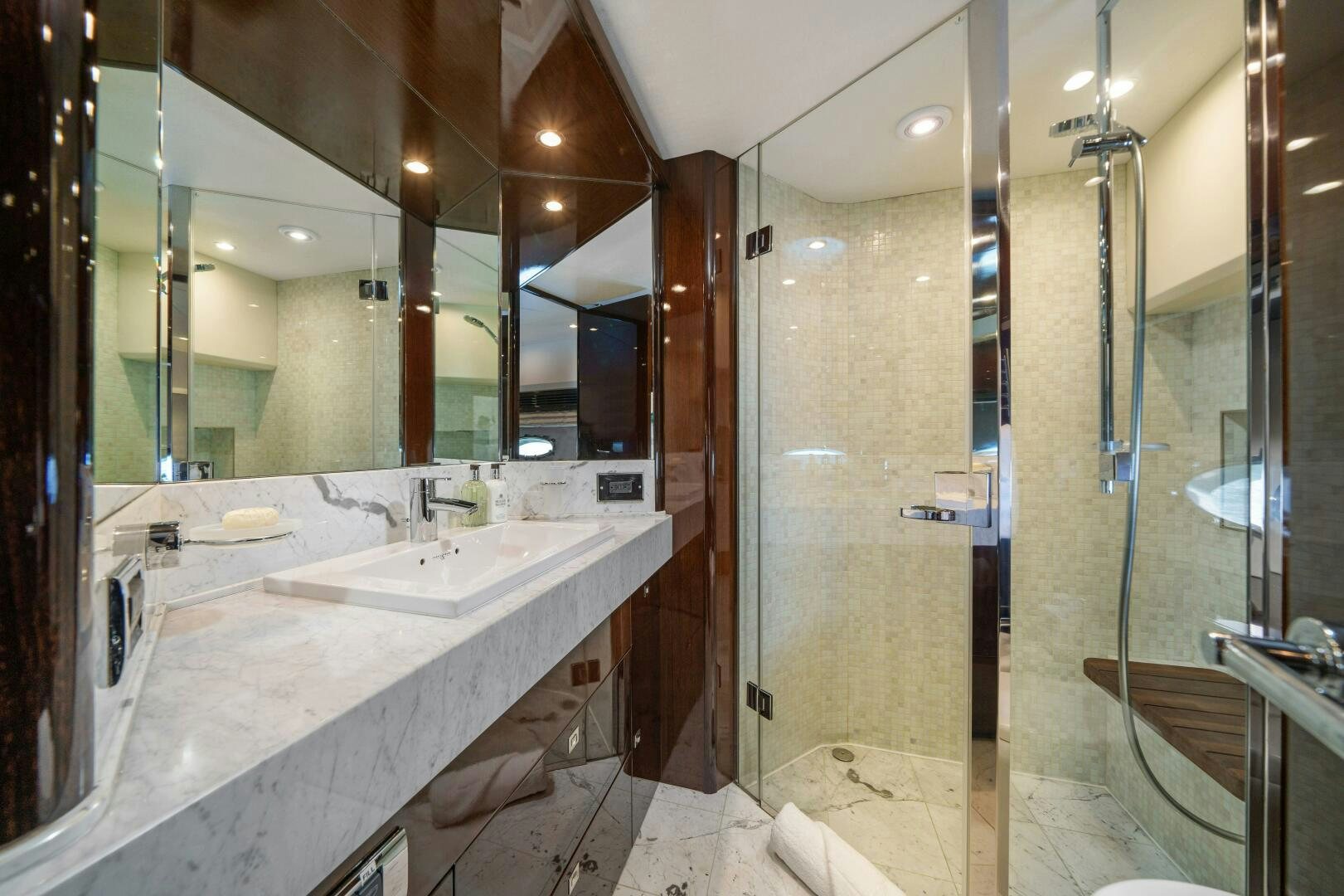 a bathroom with a large mirror aboard CURRENT SEA Yacht for Sale