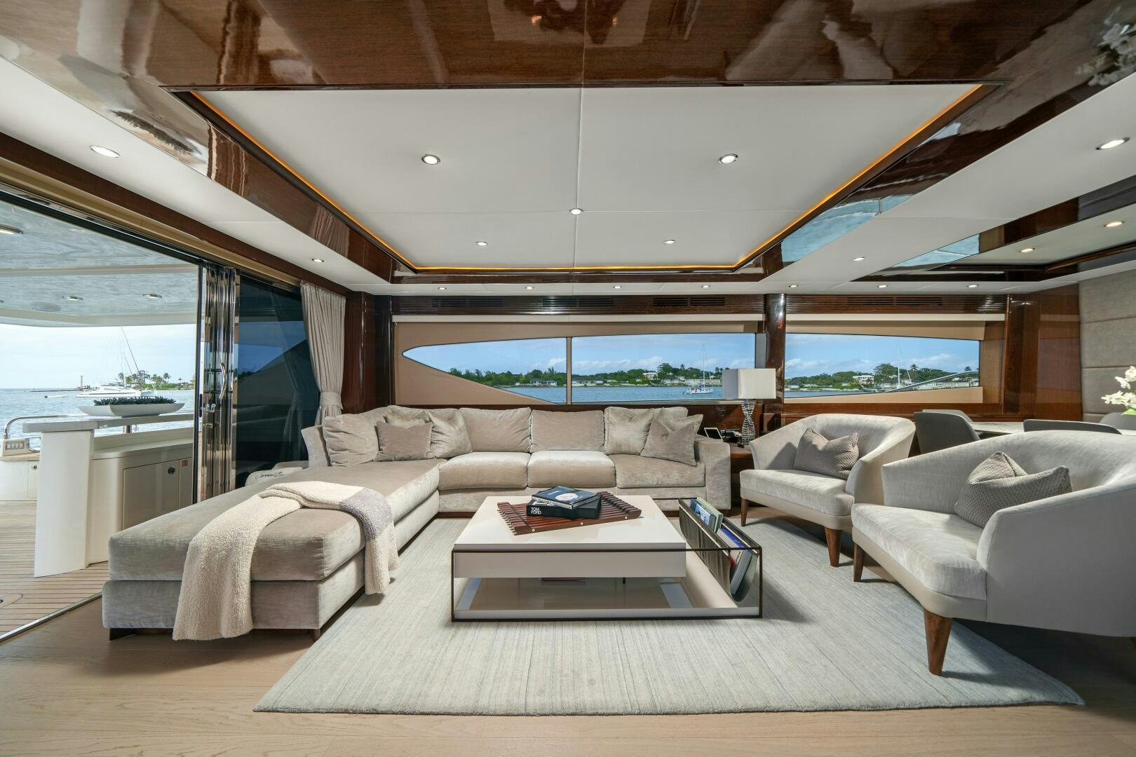 a living room with a large window aboard CURRENT SEA Yacht for Sale