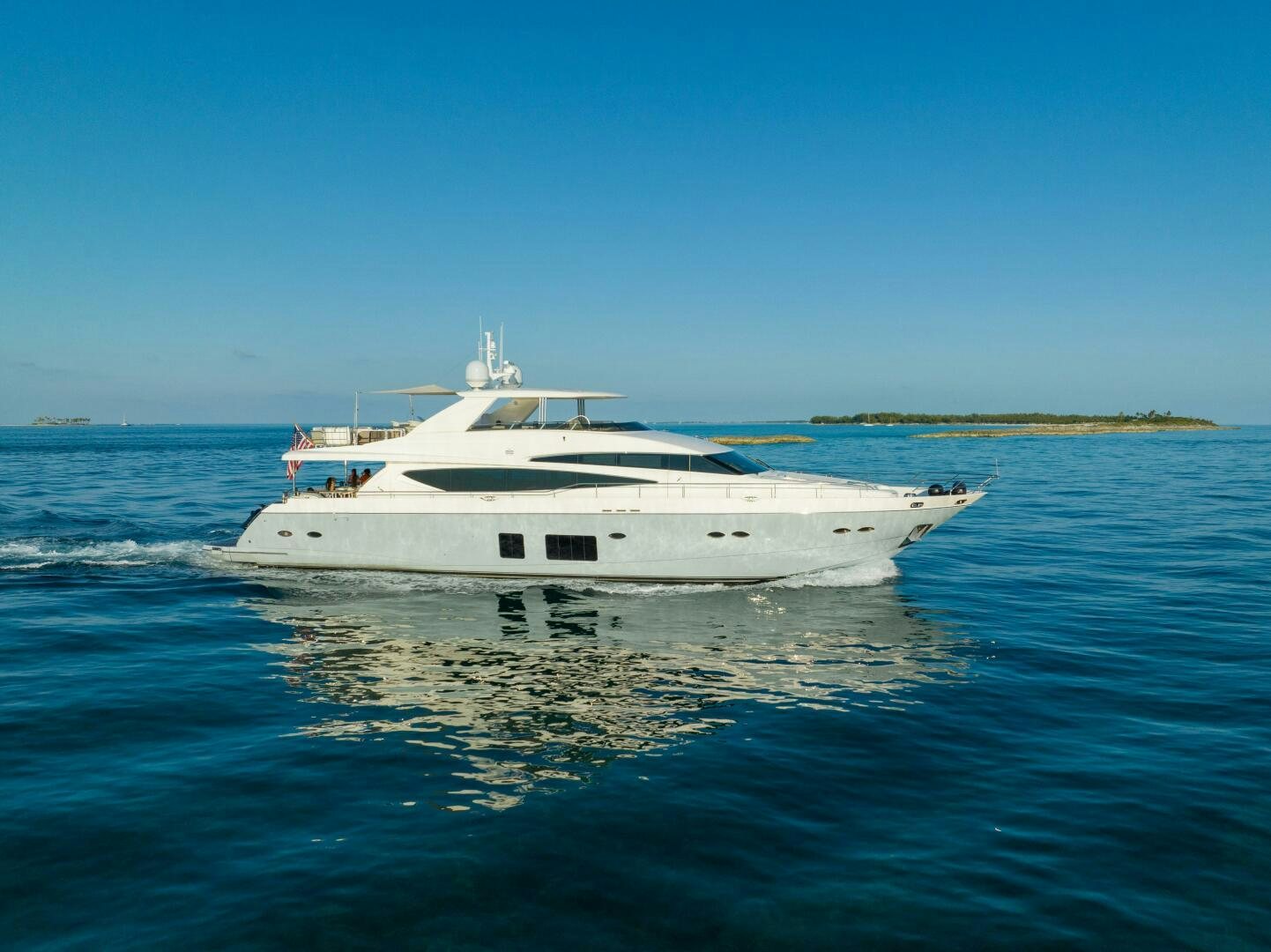 a white yacht in the water aboard CURRENT SEA Yacht for Sale