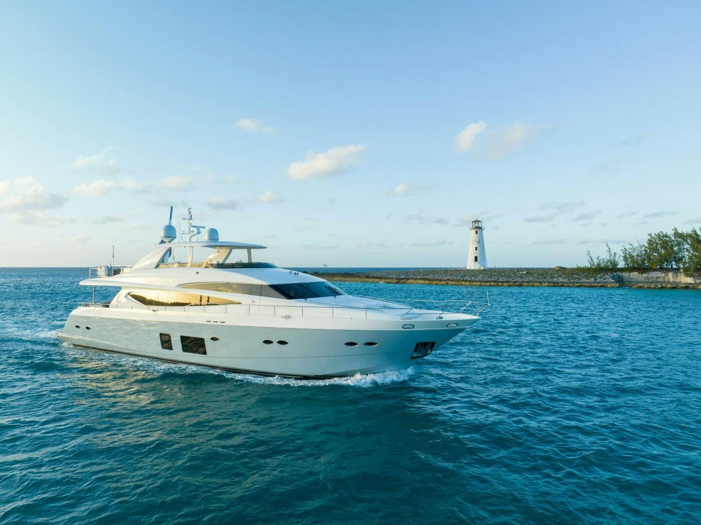 a white boat in the water aboard CURRENT SEA Yacht for Sale