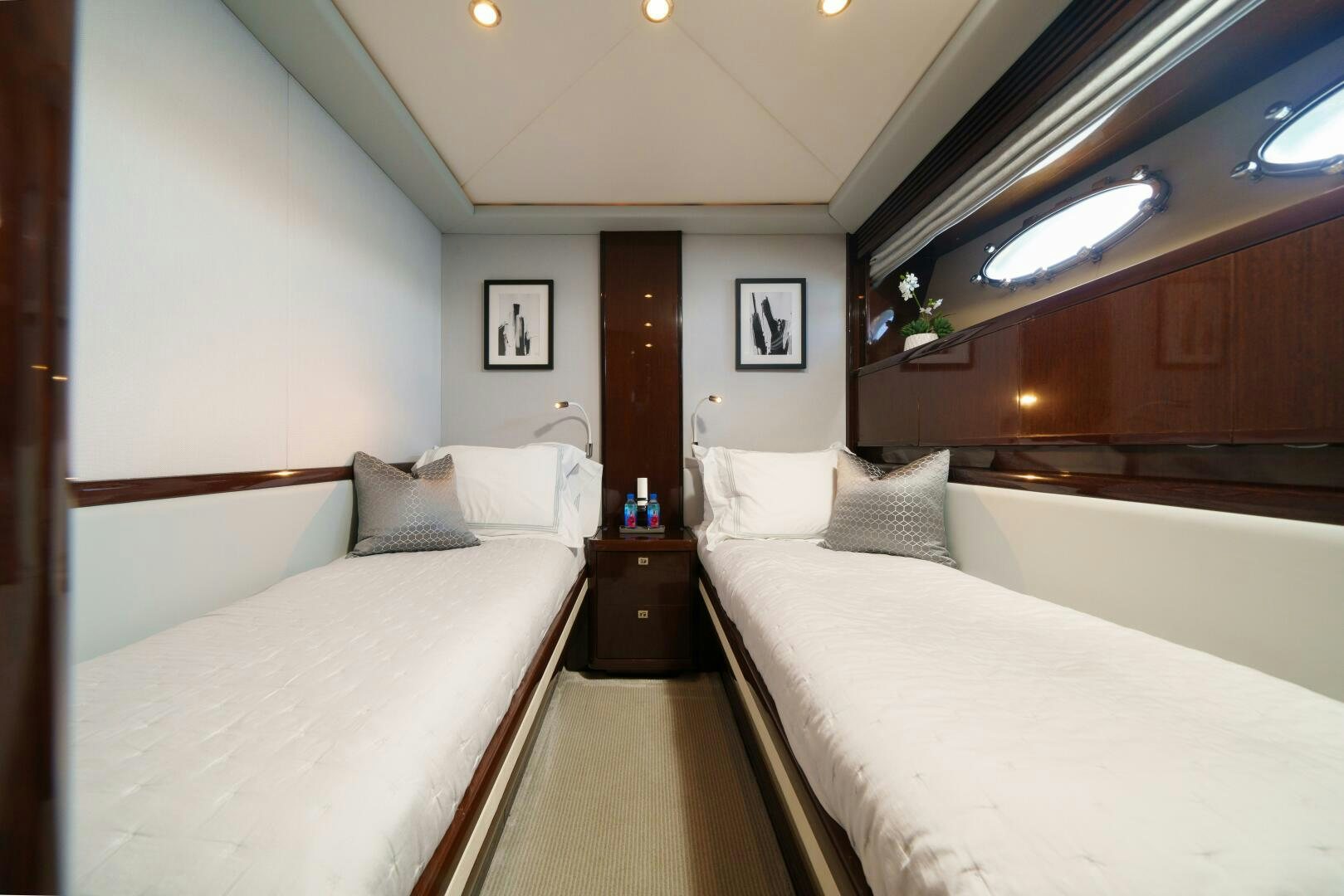 a room with two beds aboard CURRENT SEA Yacht for Sale