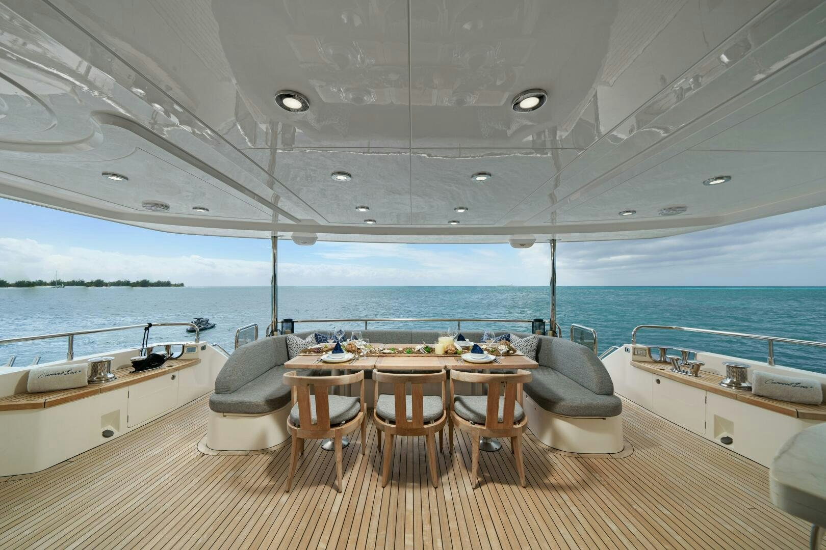 a room with a table and chairs aboard CURRENT SEA Yacht for Sale