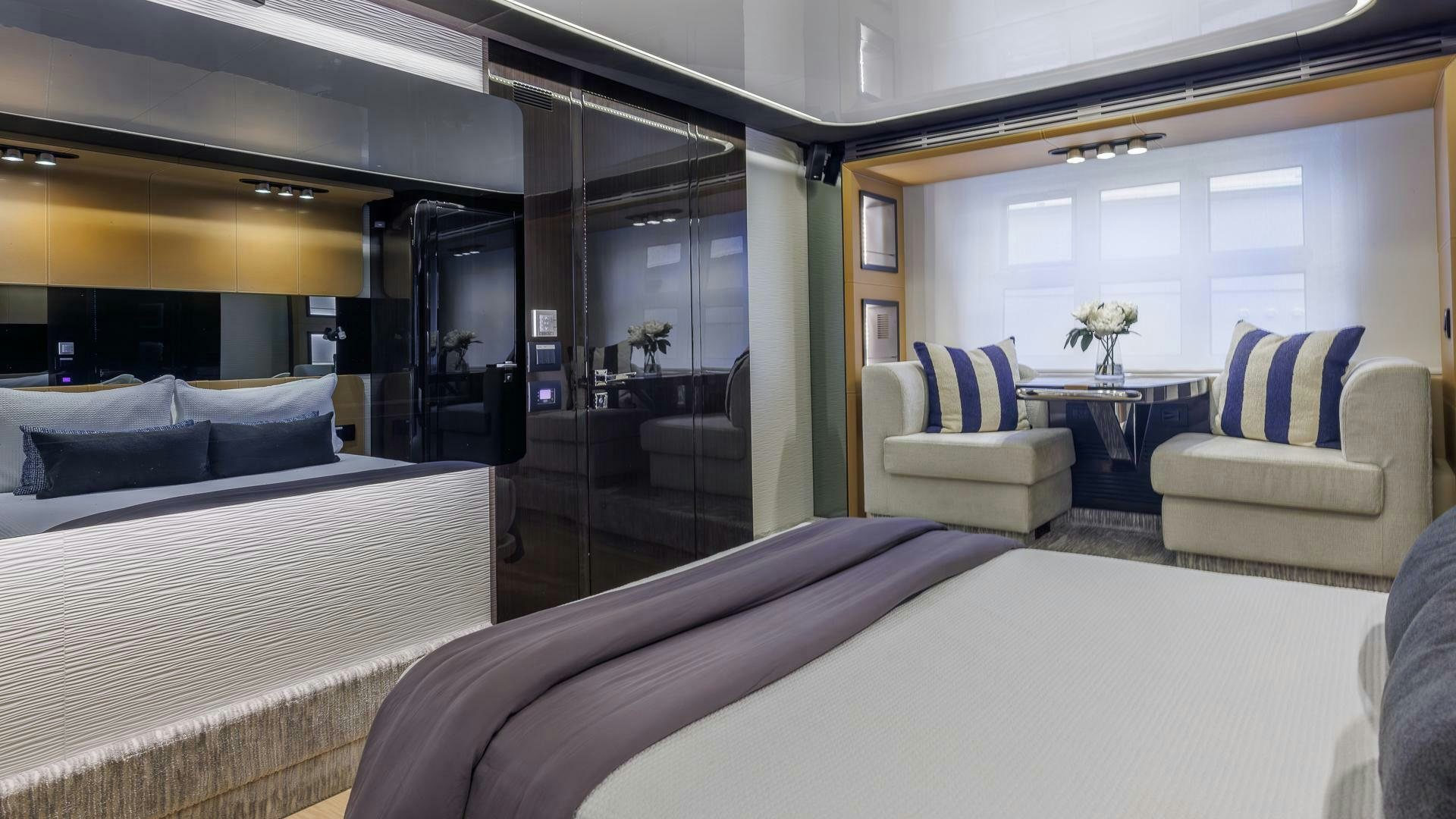 a room with a bed and a couch aboard DEVENZO Yacht for Sale