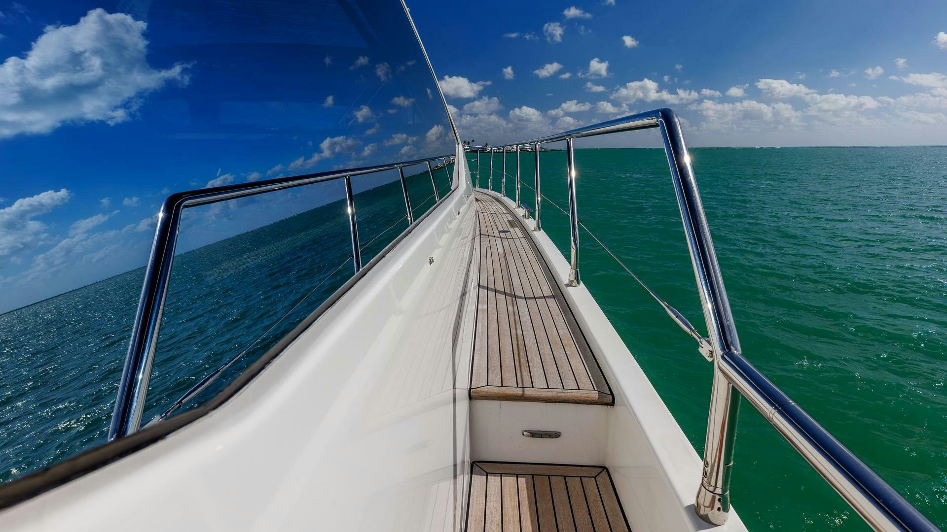 a long white boat on water aboard DEVENZO Yacht for Sale